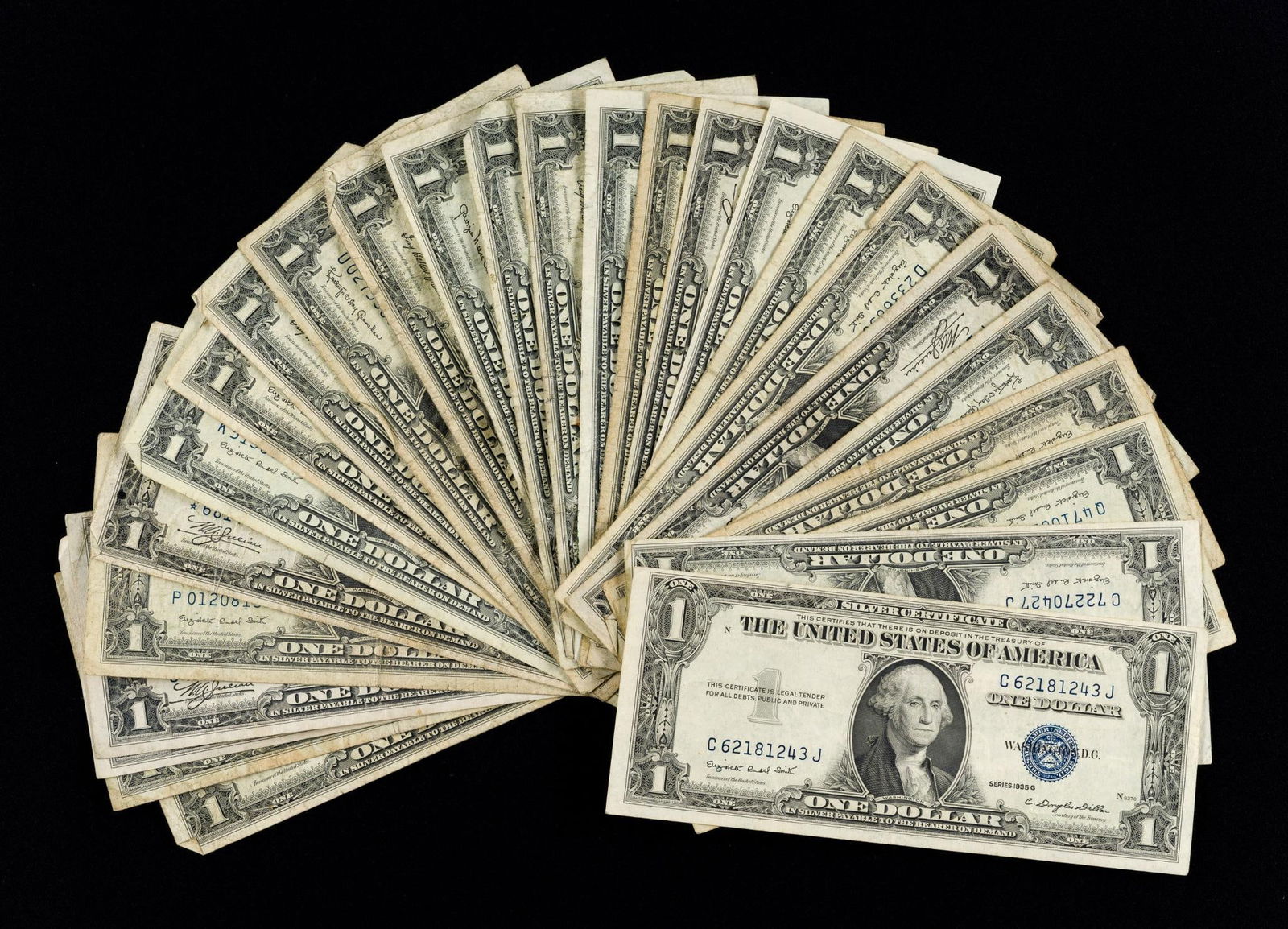 Twenty Six Silver Certificates Including 1935 A With Red R And Red S: Two rare $1 Silver Certificate bills included are 1935 A, one with the red R and one with the red S. An experimental overprinting.