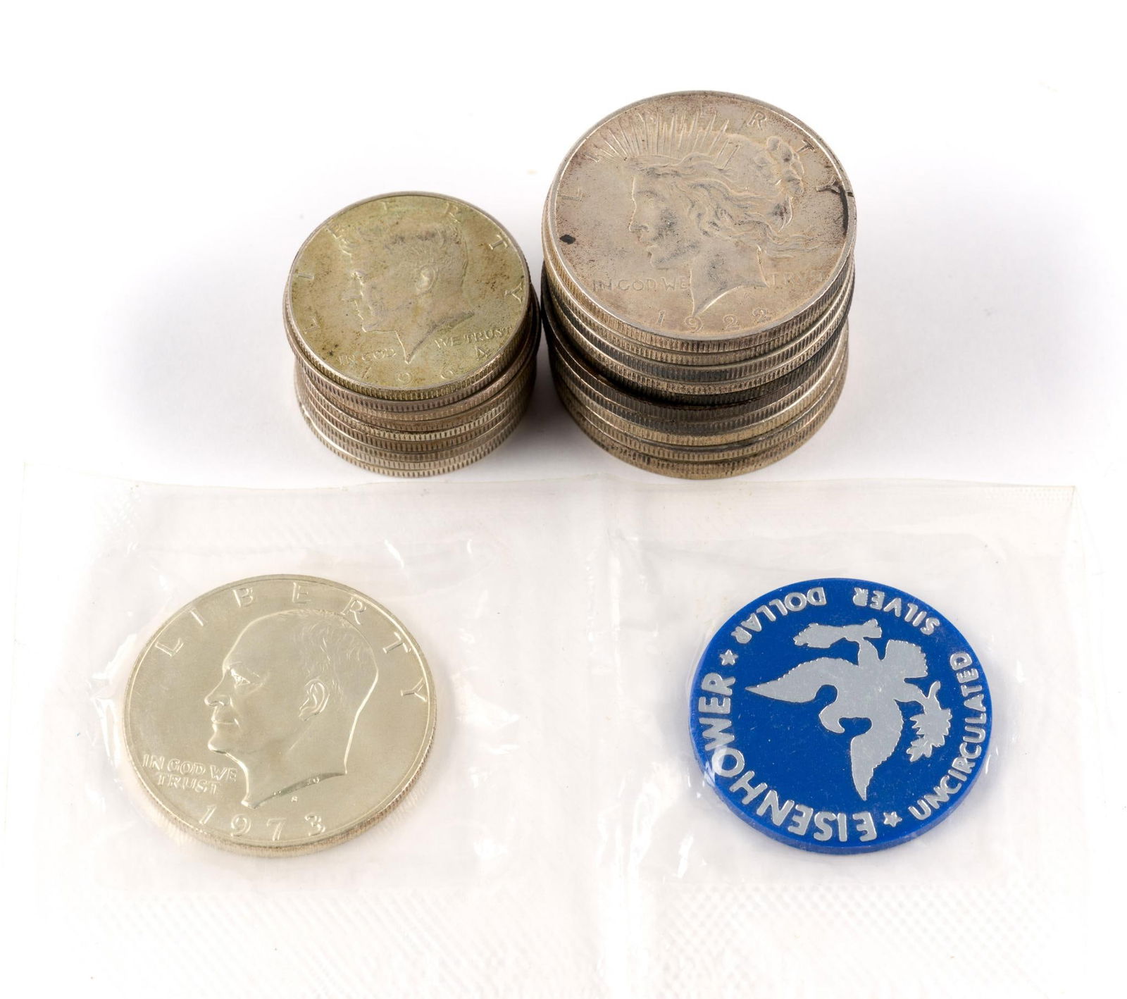 Silver Peace Dollars Half Dollars: Ten Peace dollars, one Morgan dollar, nine silver half dollars including Walking Liberty, one 40% silver Eisenhower dollar