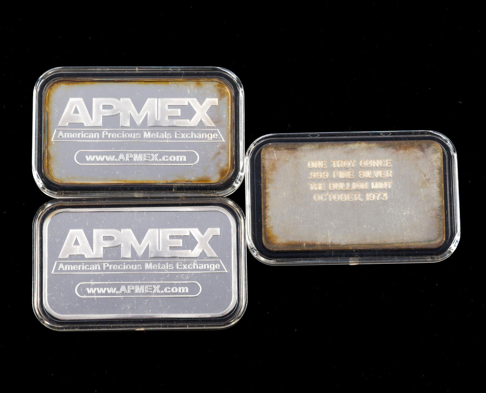 Three Pure Silver Bars Each One Troy Ounce: Two of the bars are APMEX and one is a bar produced by The Bullion Mint in 1973.