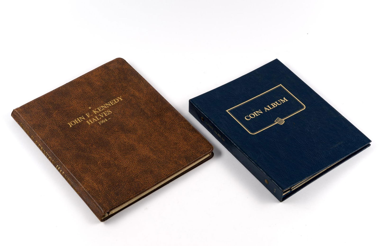 Kennedy Half Dollar And Silver Paace Dollar Books: Thirty eight Kennedy halves and eleven Peace dollars including 1921. Several silver coins in the Kennedy book.