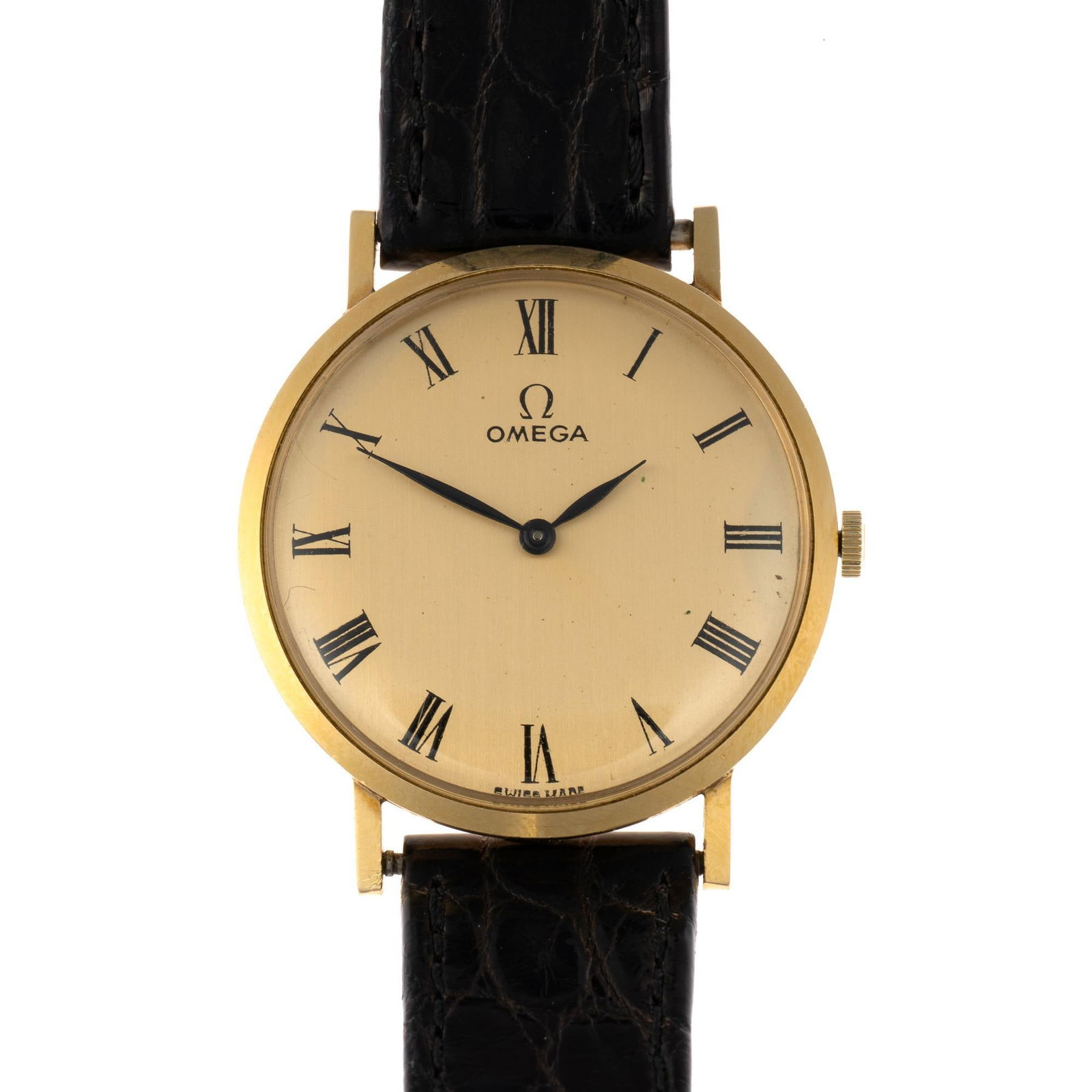 14K Gold Omega Dress Watch: A 1974 Omega Model D6672 dress watch 32 mm diameter case size not including the crown. The watch sets, runs and keeps time but has not been accuracy checked. It has the original inner and outer boxes