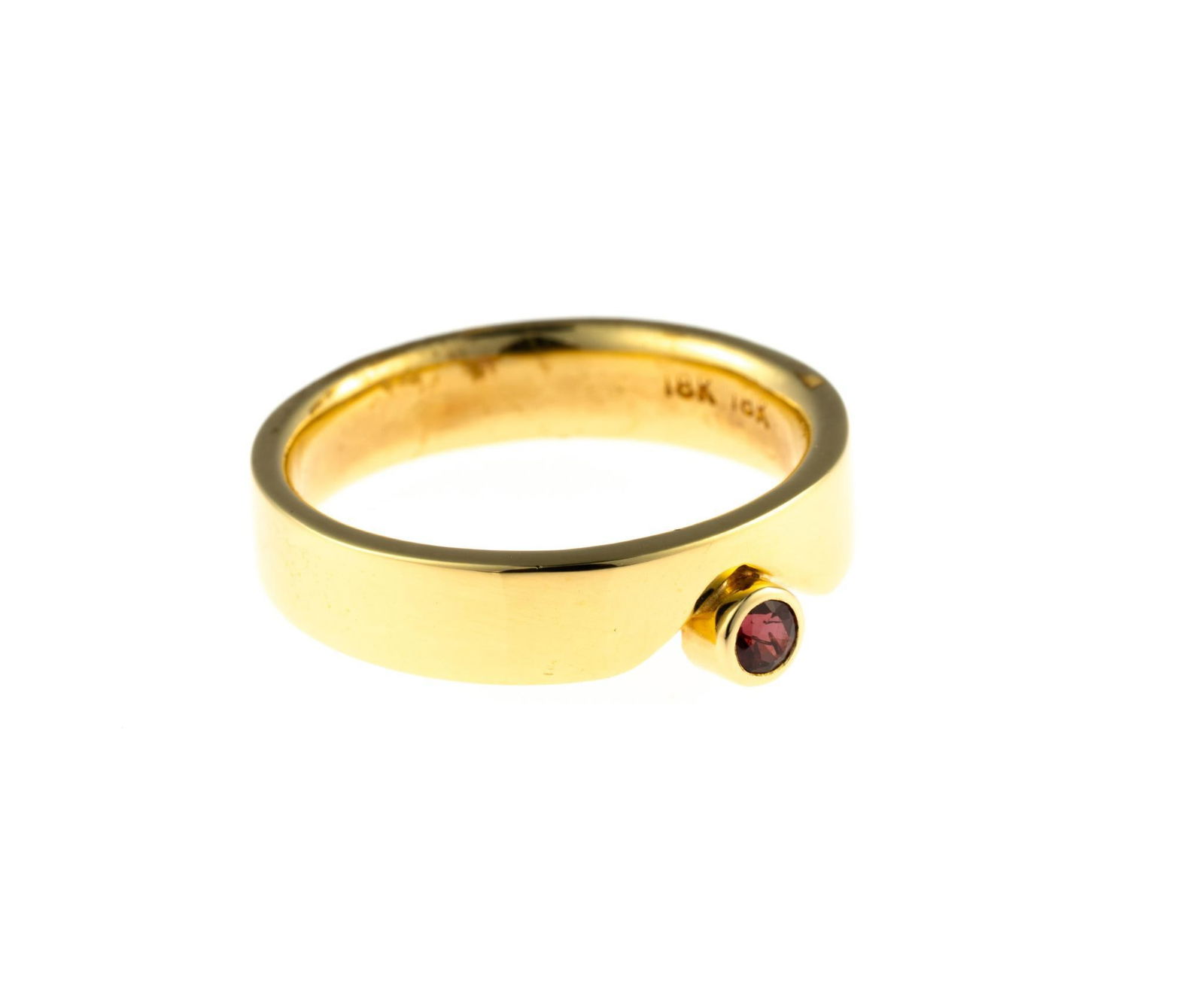 18K Gold and Ruby Ring: A size 6.25 yellow gold ring with a round cut ruby approximately 0.11 carat. This is an unused, custom designed ring from the collection of a retiring GIA Graduate Gemologist and jewelry designer. The