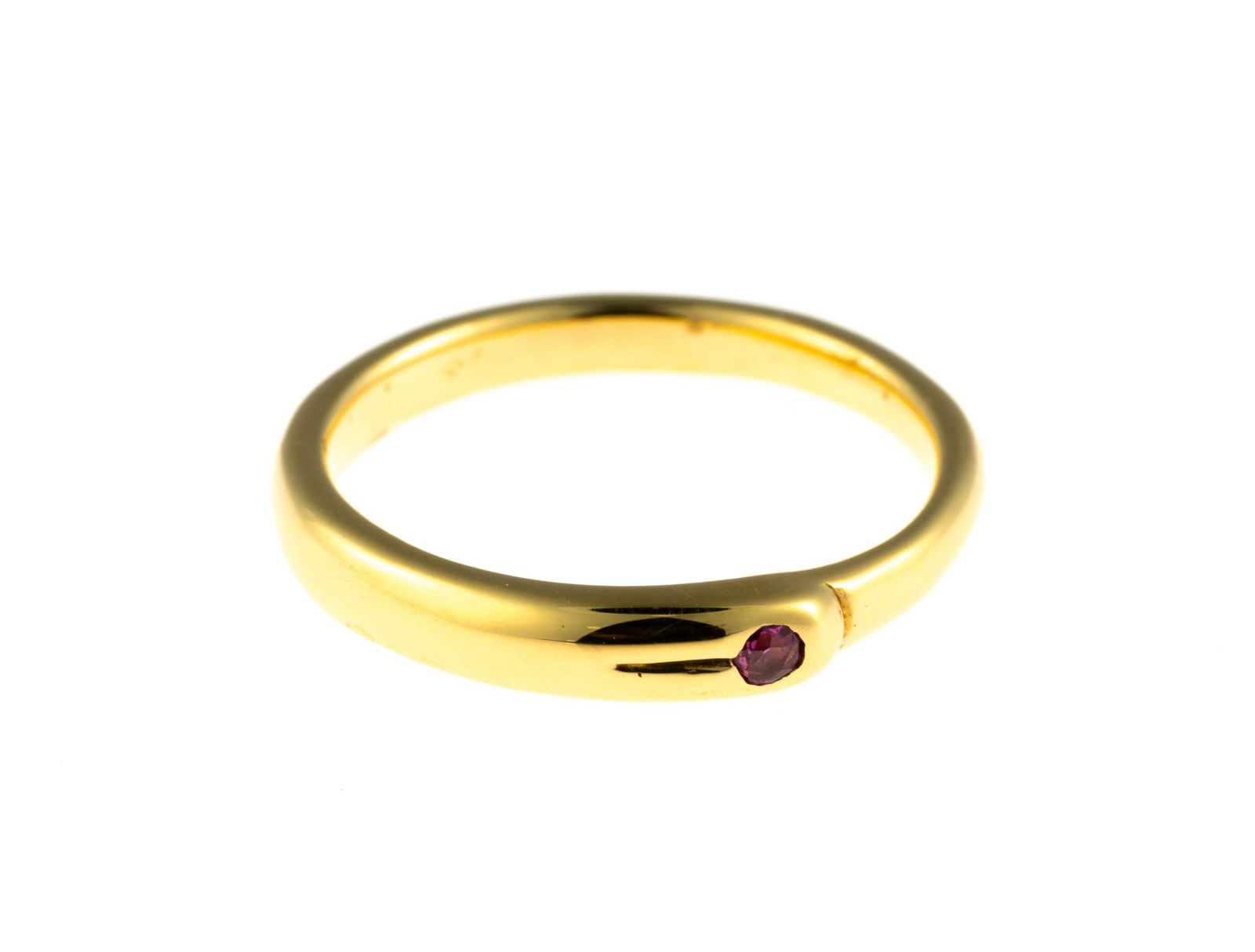 18K Gold and Ruby Ring: A size 6.25 yellow gold ring enhanced by a ruby. This is an unused, custom designed ring from the collection of a retiring GIA Graduate Gemologist and jewelry designer. The weight is 3.6 grams and it