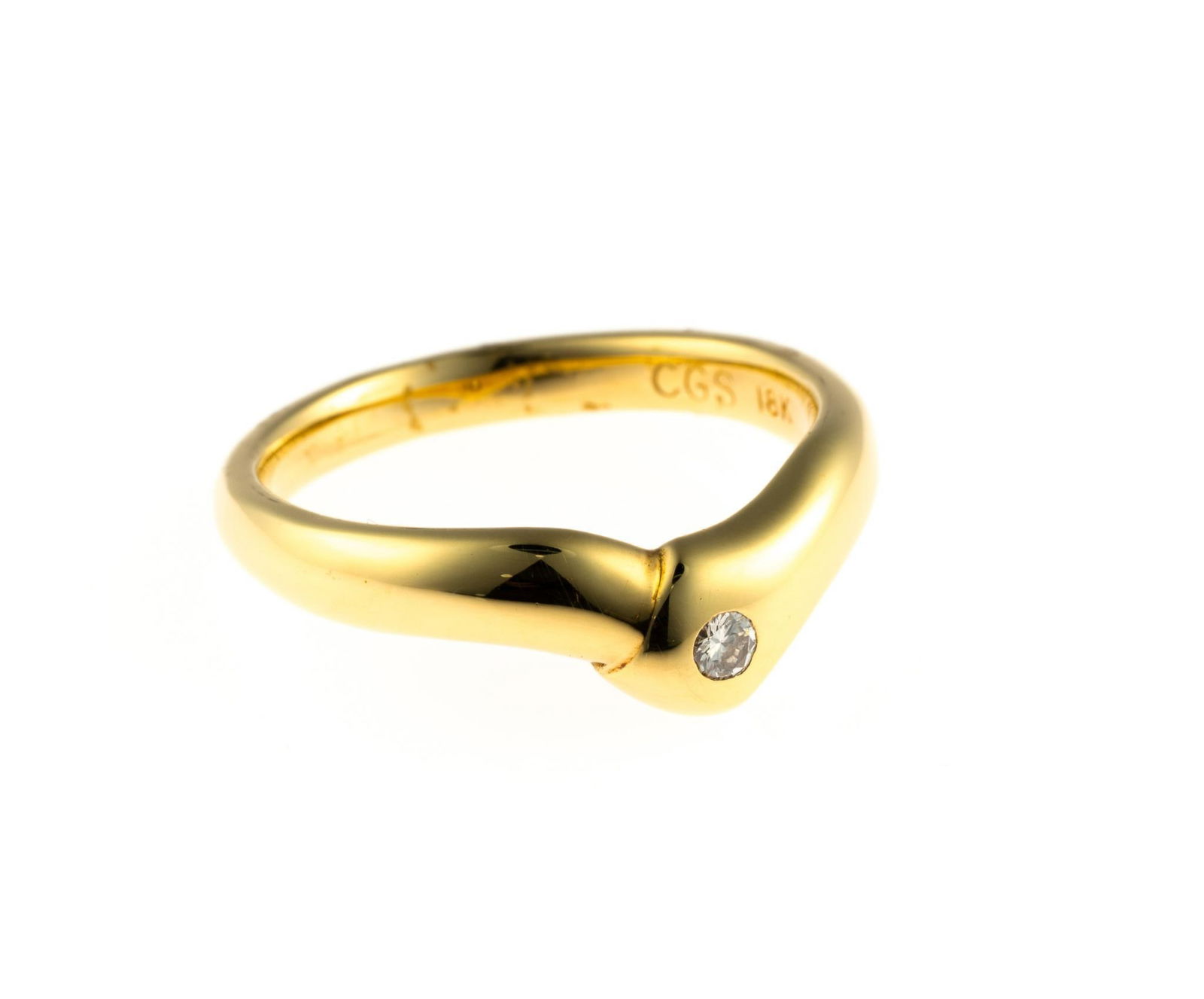 18K Gold and Diamond Ring: A size 6 yellow gold ring enhanced by a .07 carat round brilliant cut diamond. This is an unused, custom designed ring from the collection of a retiring GIA Graduate Gemologist and jewelry designer.