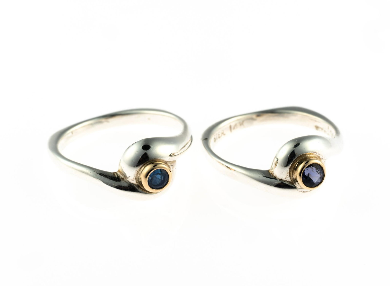 Two Sterling and 14K Gold Gemstone Rings: Both rings are sterling silver, size 7 to 7.25, one with blue sapphire and one with tanzanite, each mounted in 14k gold. Total weight is 6.8 grams.