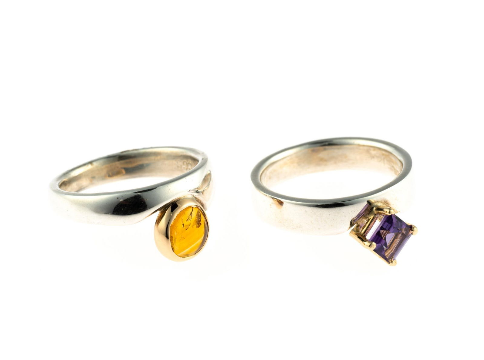 Two Sterling and 14K Gold Gemstone Rings: Both rings are sterling silver, size 6 to 6.25, one with citrine and one with amethyst mounted in 14k gold. Total weight is 9.0 grams.