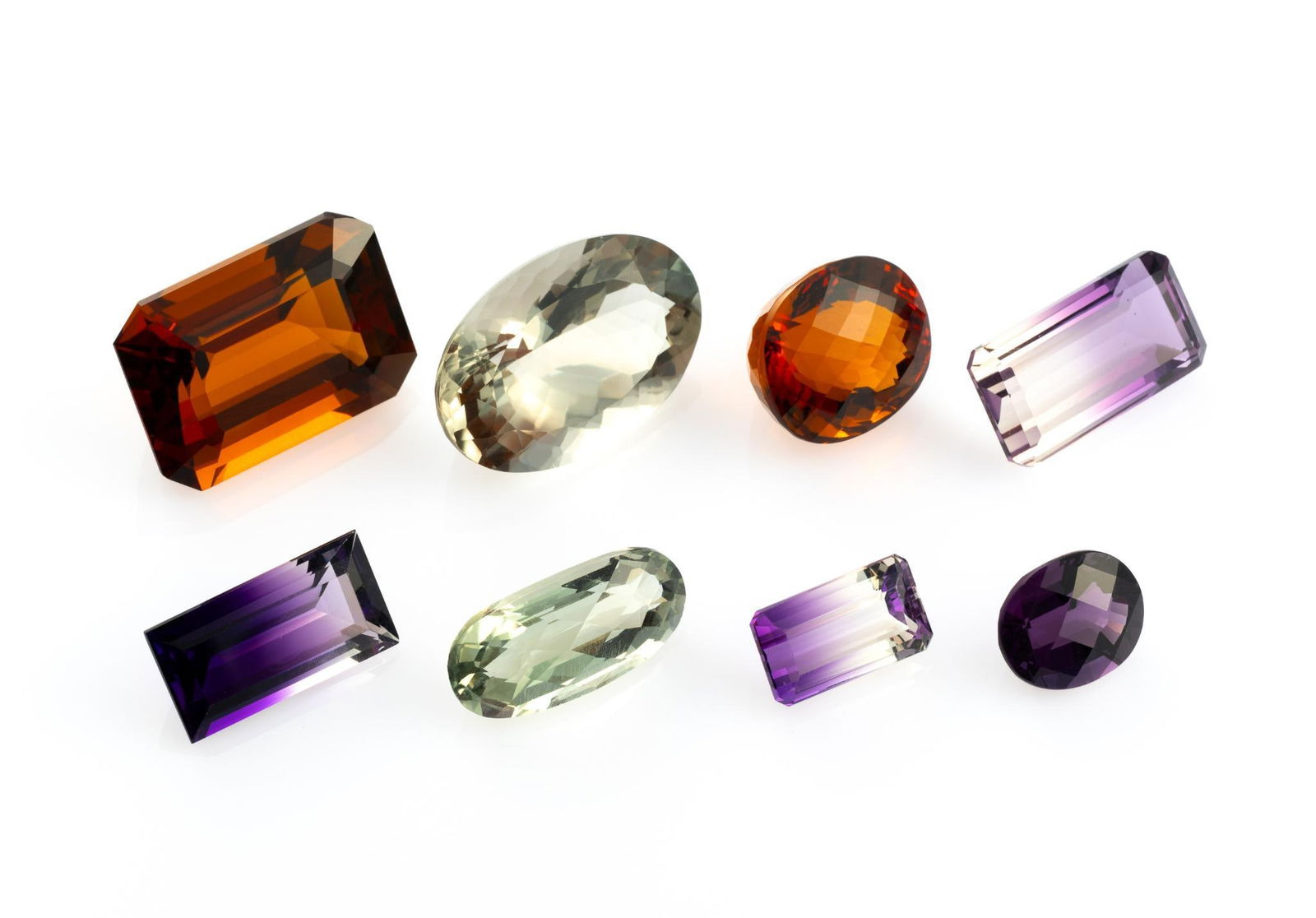Eight Large Gemstones incl Ametrine and Amethyst: 17.73 carat light green amethyst oval cut, Africa. 25.7 carat ametrine octagonal cut, Brazil. 62.43 carat citrine, emerald cut, Brazil. 16.58 carat ametrine, emerald cut, Bolivia. 10.39 carat emerald
