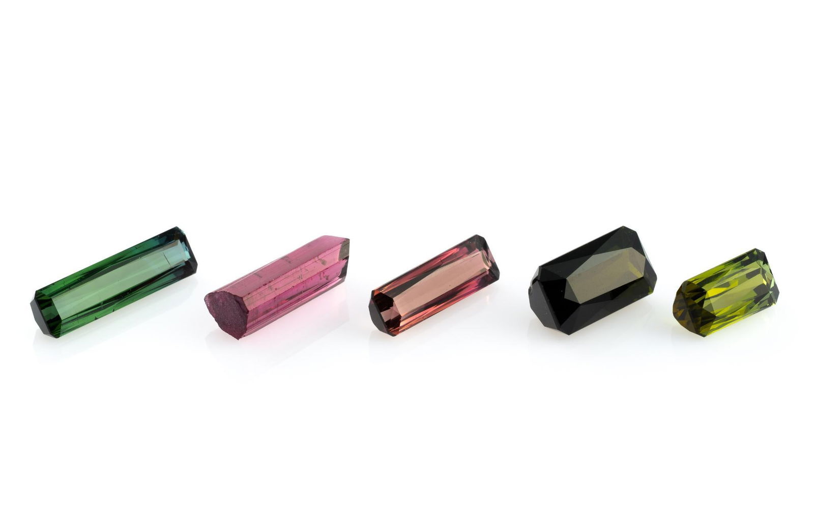 Five Tourmaline Gemstones: 4.21 carat baguette cut rose pink tourmaline, Nigeria. 5.63 carat rectangular cut blue green tourmaline, Nigeria. 7.41 carat hot pink terminated crystal tourmaline, Minas, Brazil. 8.62 carat emerald