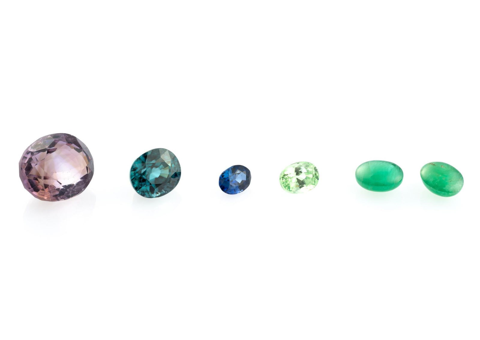 Six Gemstones incl Ceylon Sapphire: 0.83 carat loose oval cornflower blue sapphire, Ceylon. Collector's record indicates heated for this sapphire. 4.84 oval deep blue natural zircon, Cambodia. 1.3 carat oval light green tsavorite garnet