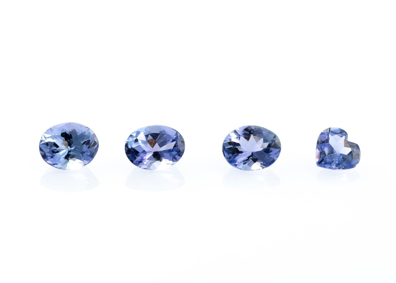 Four Tanzanite Gemstones: 0.63 carat oval blue violet natural tanzanite, Tanzania. 0.68 carat oval blue violet natural tanzanite, Tanzania. 0.64 carat oval blue violet natural tanzanite, Tanzania. 0.45 carat oval blue violet n