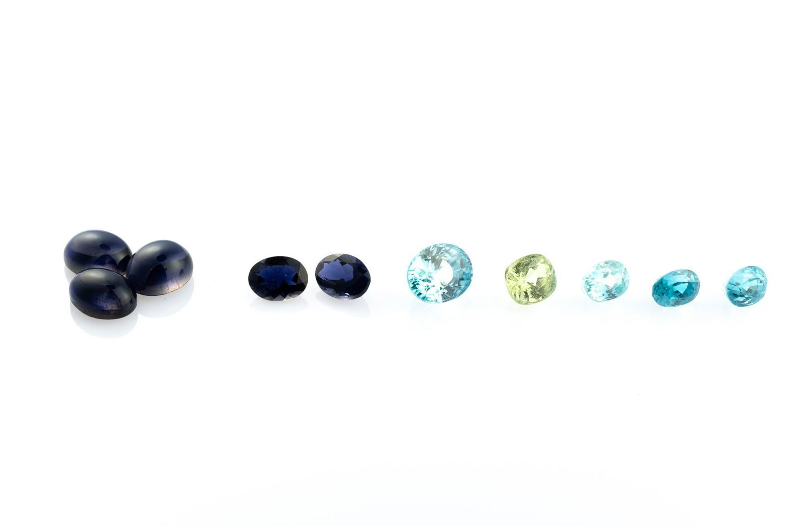 Ten Gemstones incl Iolite: Three oval cabochon purple Iolite 8.05 carats total, treatment: natural (gemologist's record), Sri Lanka. Two oval deep blue Iolite 1.95 carats total, treatment: none (gemologist's record),