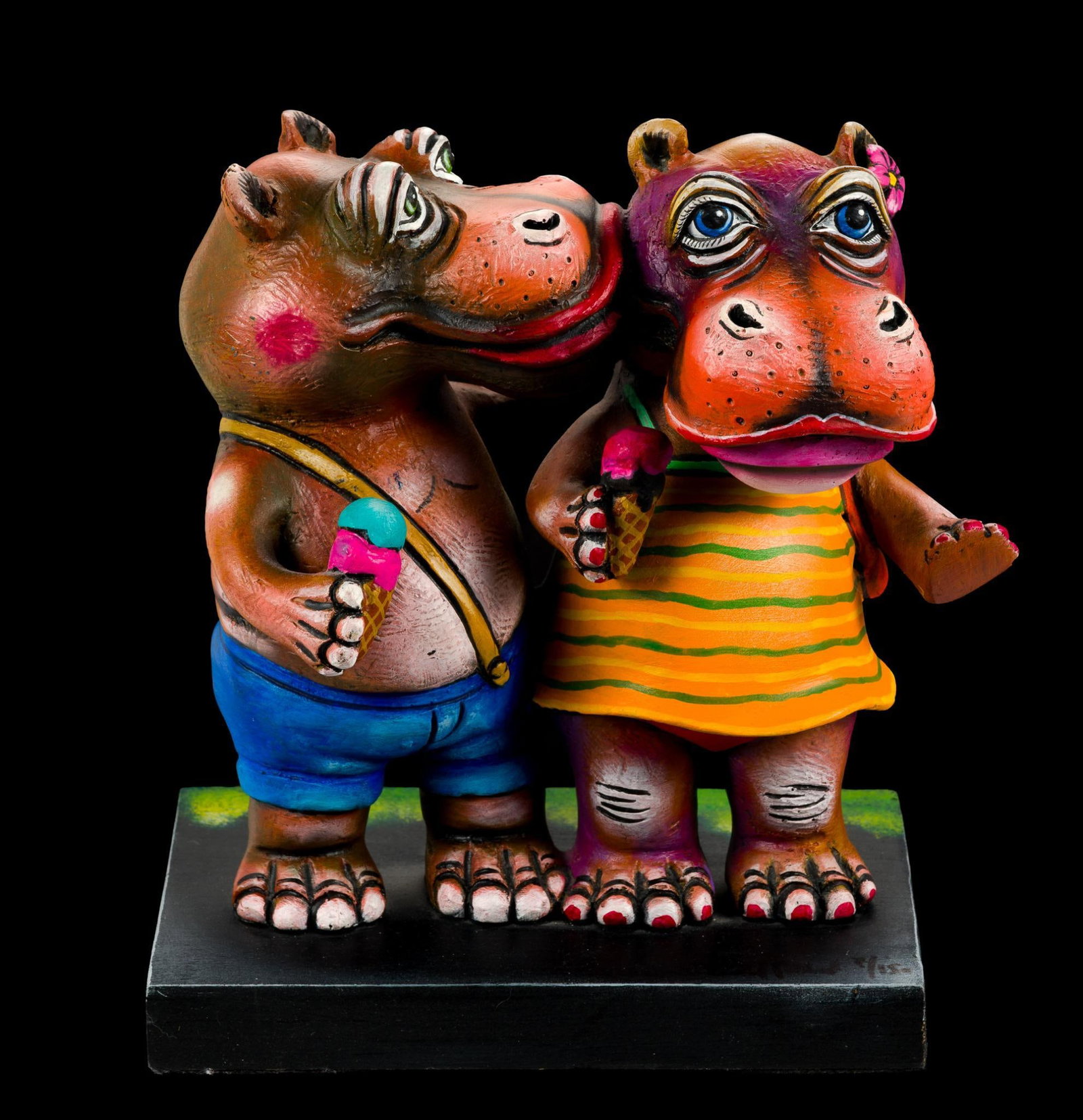 Carlos & Albert Hippos Sculpture: A sculpture by Carlos Munoz and Albert Ickenroth depicting boy and girl hippos. The height is 8" and the base is 6 3/4" X 5". Number 7 of 150.