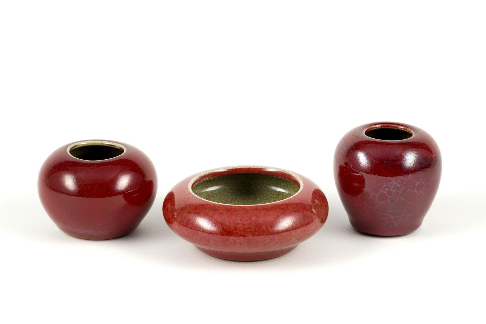Three Chinese Sang De Boeuf Ceramics: The heights range from 1 3/4" to 2 3/4" and diameter 3" to 4 1/2".