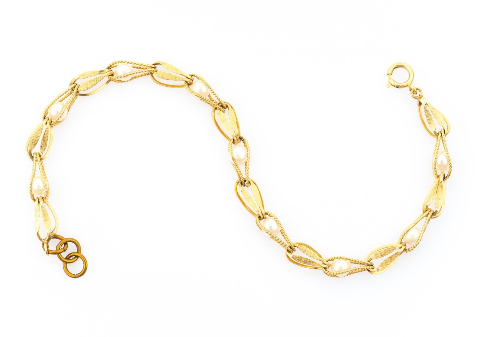 14K Gold Pearl Bracelet: A 7" yellow gold bracelet with small pearl enhancements. The bracelet weighs 4.8 grams.