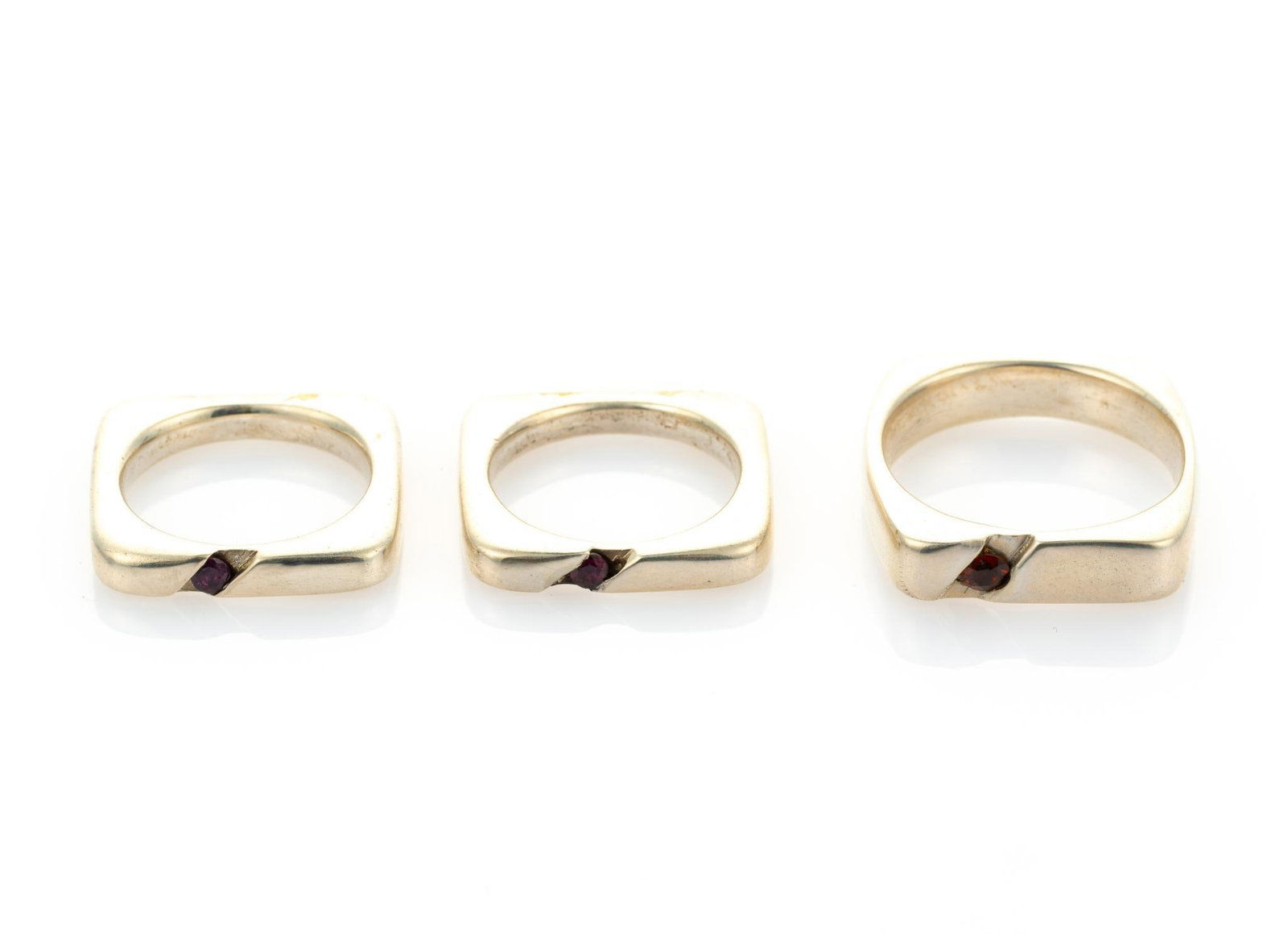 3 Sterling Silver & Ruby Rings: All round cut, heated rubies. One VS clarity and two SI clarity. Ring sizes 5.5 to 10. Total 0.66 ozt. Gemstones include Amethyst & 2 Rhodolite. Amethyst is purple, round brilliant cut, natural, VS cl