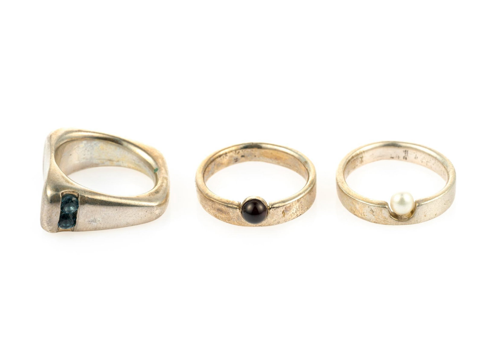 3 Sterling Silver & Gemstone Rings: Includes topaz round cut, irradiated; garnet round cut, natural; and pearl round cut, natural. Ring sizes 5.5 to 6.5. Total 0.62 ozt. Gemstones include Amethyst & 2 Rhodolite. Amethyst is purple, roun