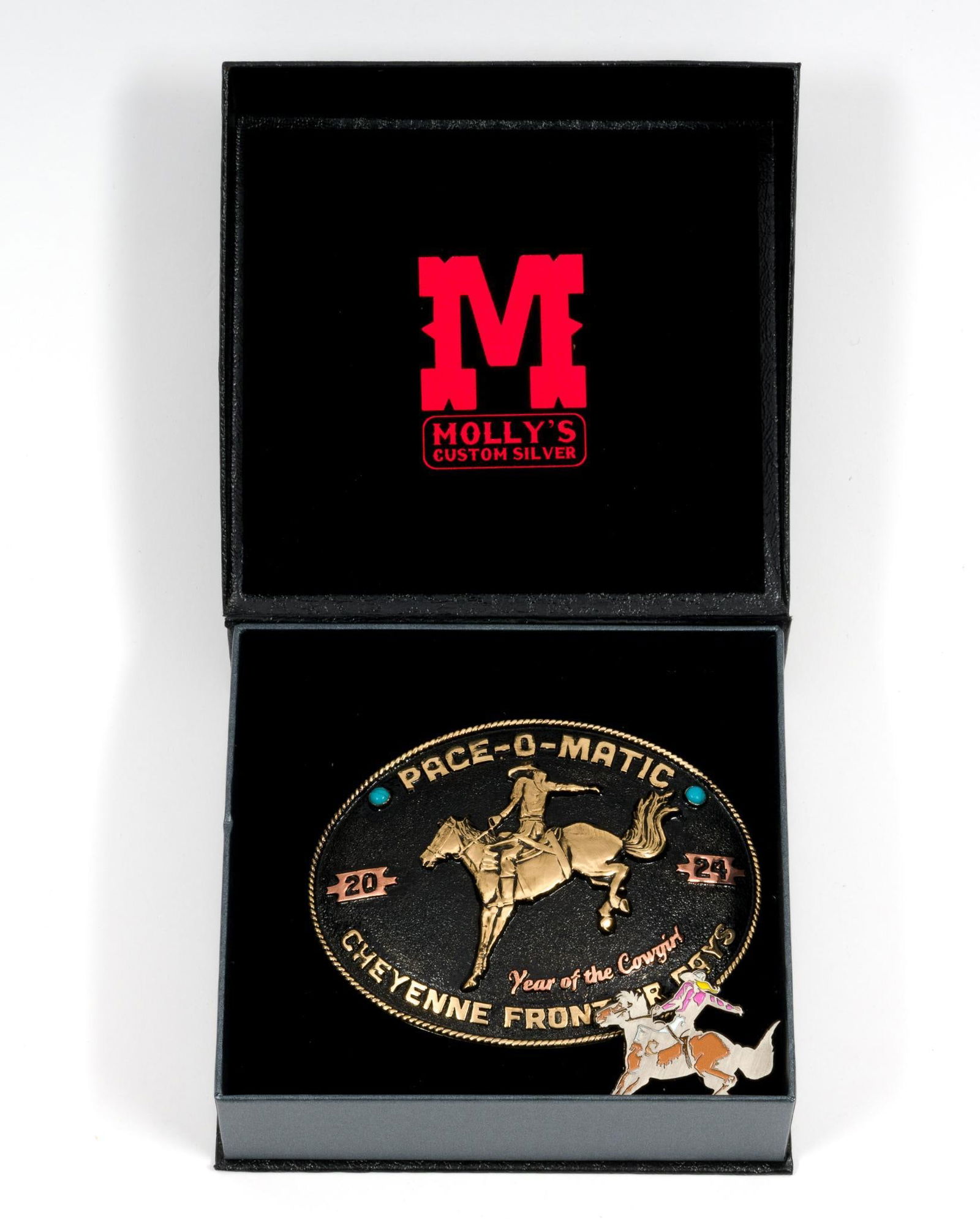 Molly's Custom Silver Belt Buckle & Pin: Belt buckle reads "Pace-O-Matic Cheyenne Frontier Days." Buckle in original box. Buckle measures 4-1/2" wide x 3-1/2" long. Pin matches design on buckle. Includes original box.