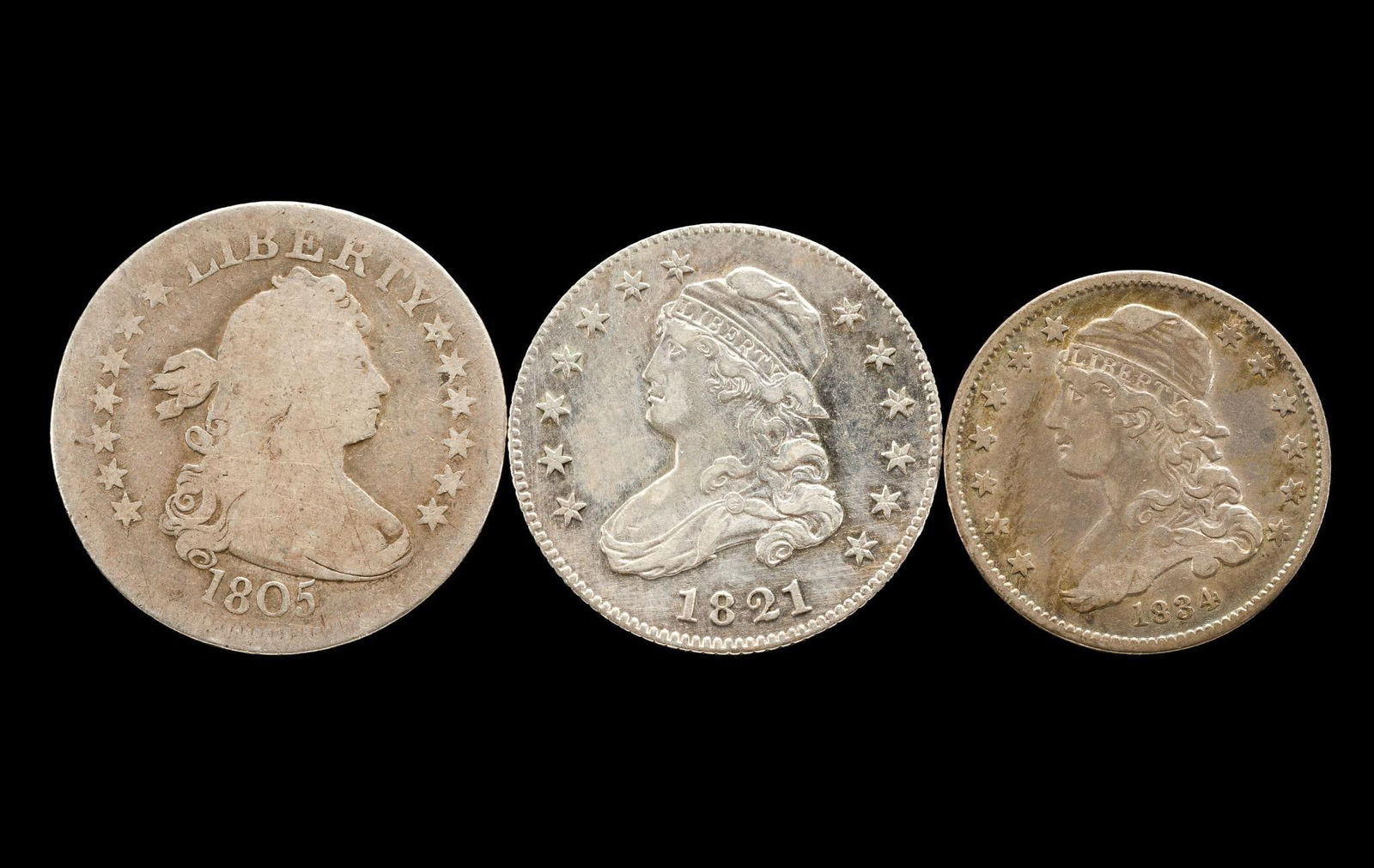 Draped Bust And Capped Bust Quarters: 1805 Draped Bust quarter, AG, 1821 capped bust quarter AU details past cleaning evidence, 1834 capped bust quarter, VF. From a high end, silver and copper United States type set with nearly every majo