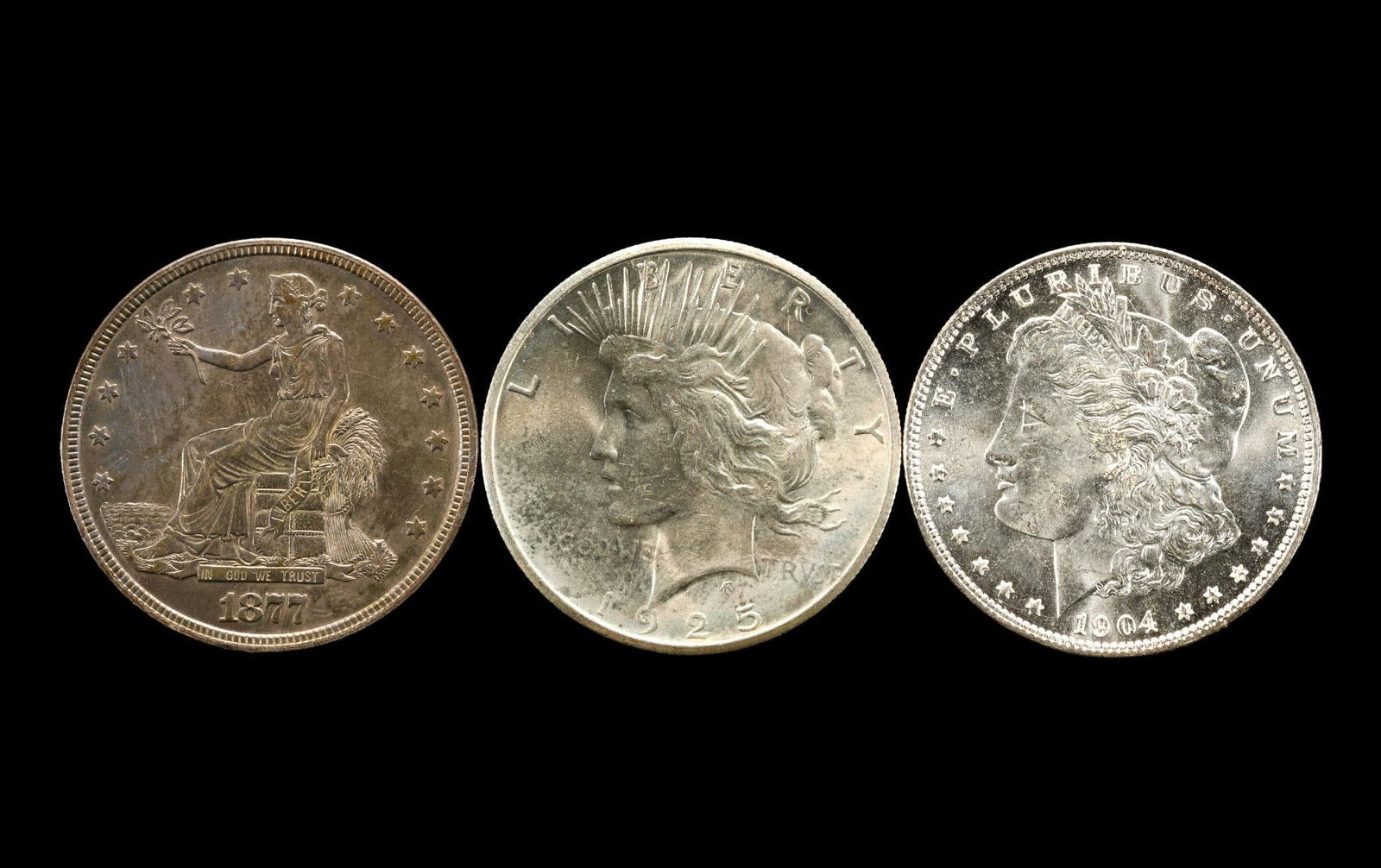 Morgan Peace and Trade Dollars: 1904-O very high grade uncirculated, approximately MS66, 1877 Trade Dollar AU to uncirculated, 1925 Peace dollar uncirculated. From a high end, silver and copper United States type set with nearly eve