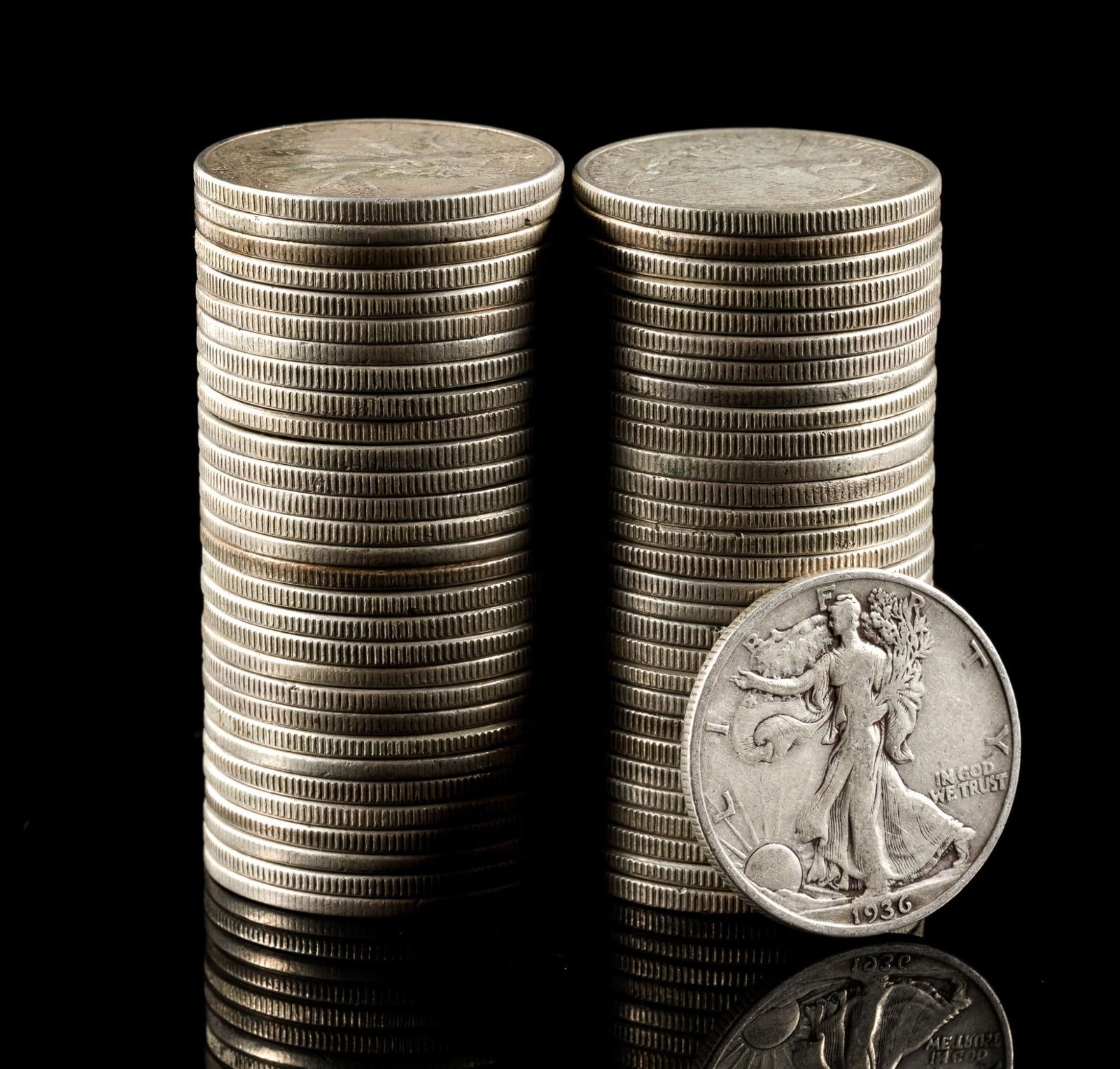 Fifty Silver Walking Liberty Half Dollars: Earlier coins have substantial wear while later coins may be AU or uncirculated.