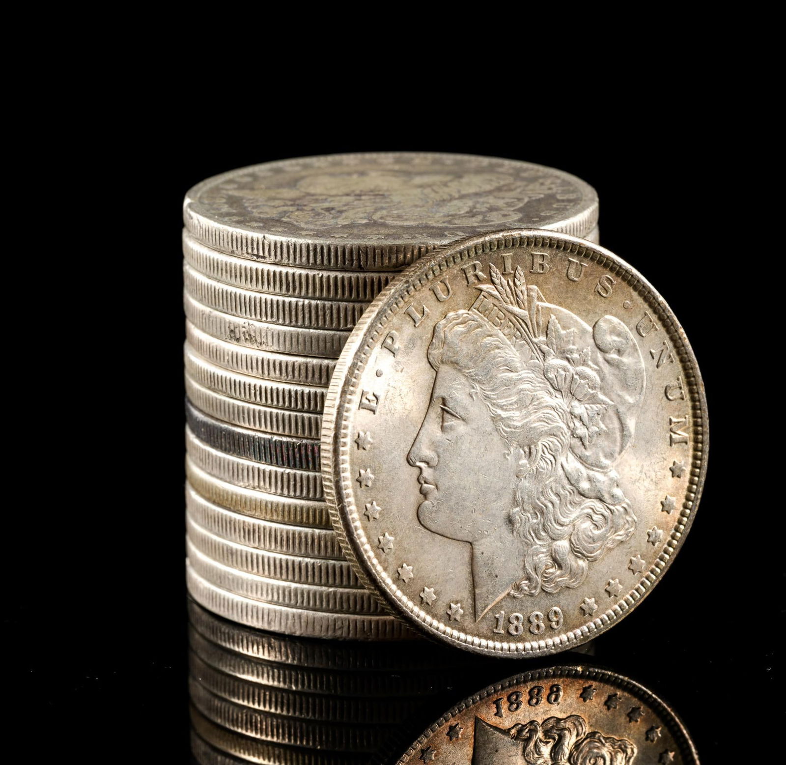 Fifteen Silver Dollars: All are Morgan Dollars.