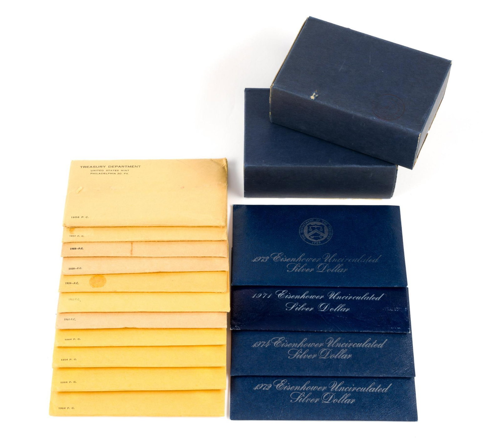 Twenty One Mint and Proof Sets and Eisenhower Dollars Silver: The group includes four silver Eisenhower dollars and eleven uncirculated pre-1965 mint sets.