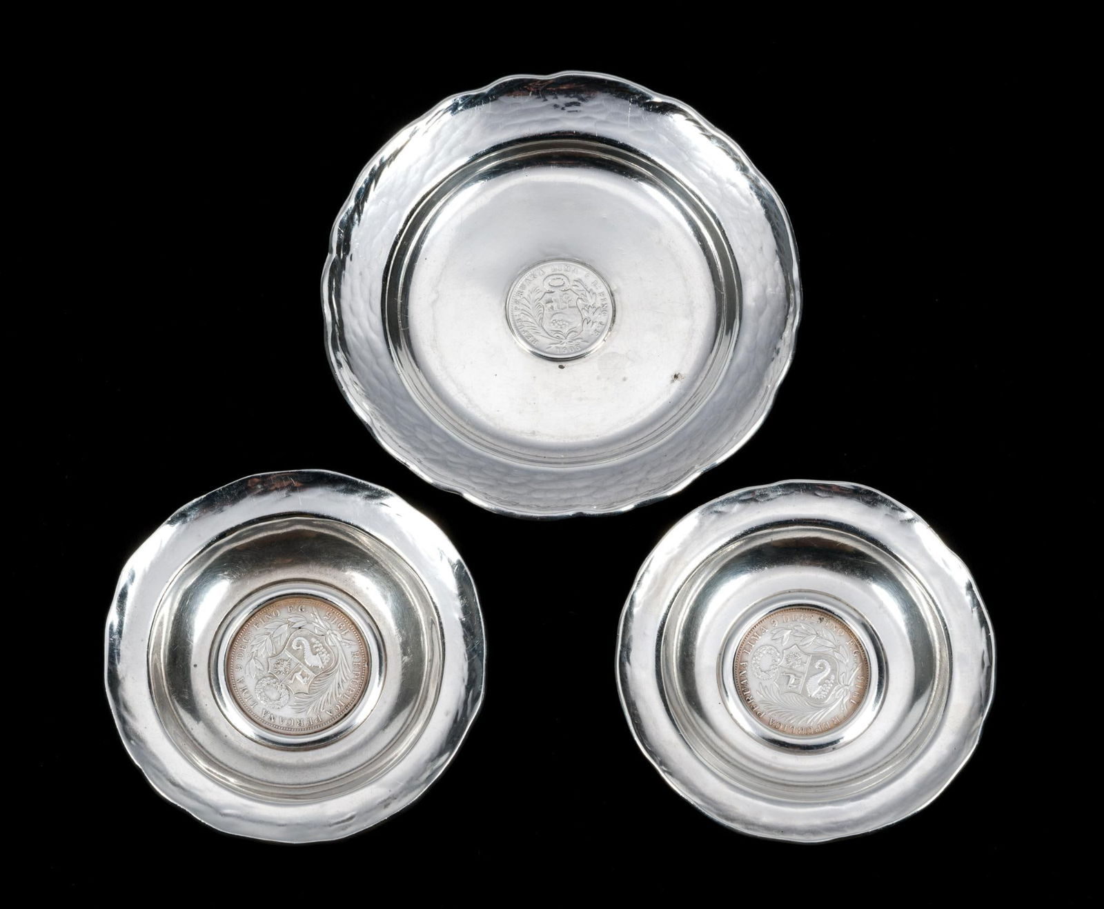 3 Peruvian Sterling Silver Coin Plates: All marked 925. Each marked Made in Peru. 4.34 ozt total. 3-1/8" to 4" wide x 3/8" to 1/2" high.