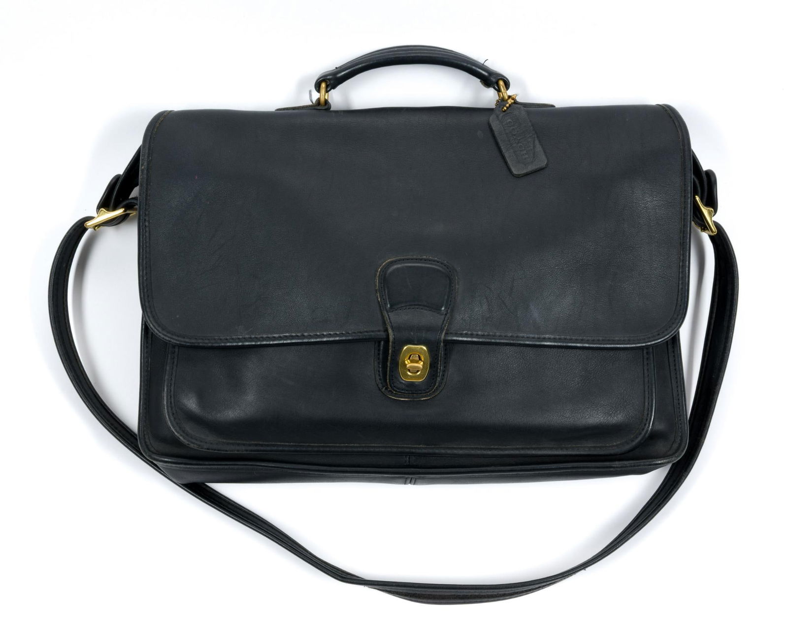 Coach Black Leather Metropolitan Briefcase: No. F9N-5180. Some wear to the closure. Some scratching consistent with use. 15-1/2" wide x 10-3/4" long.