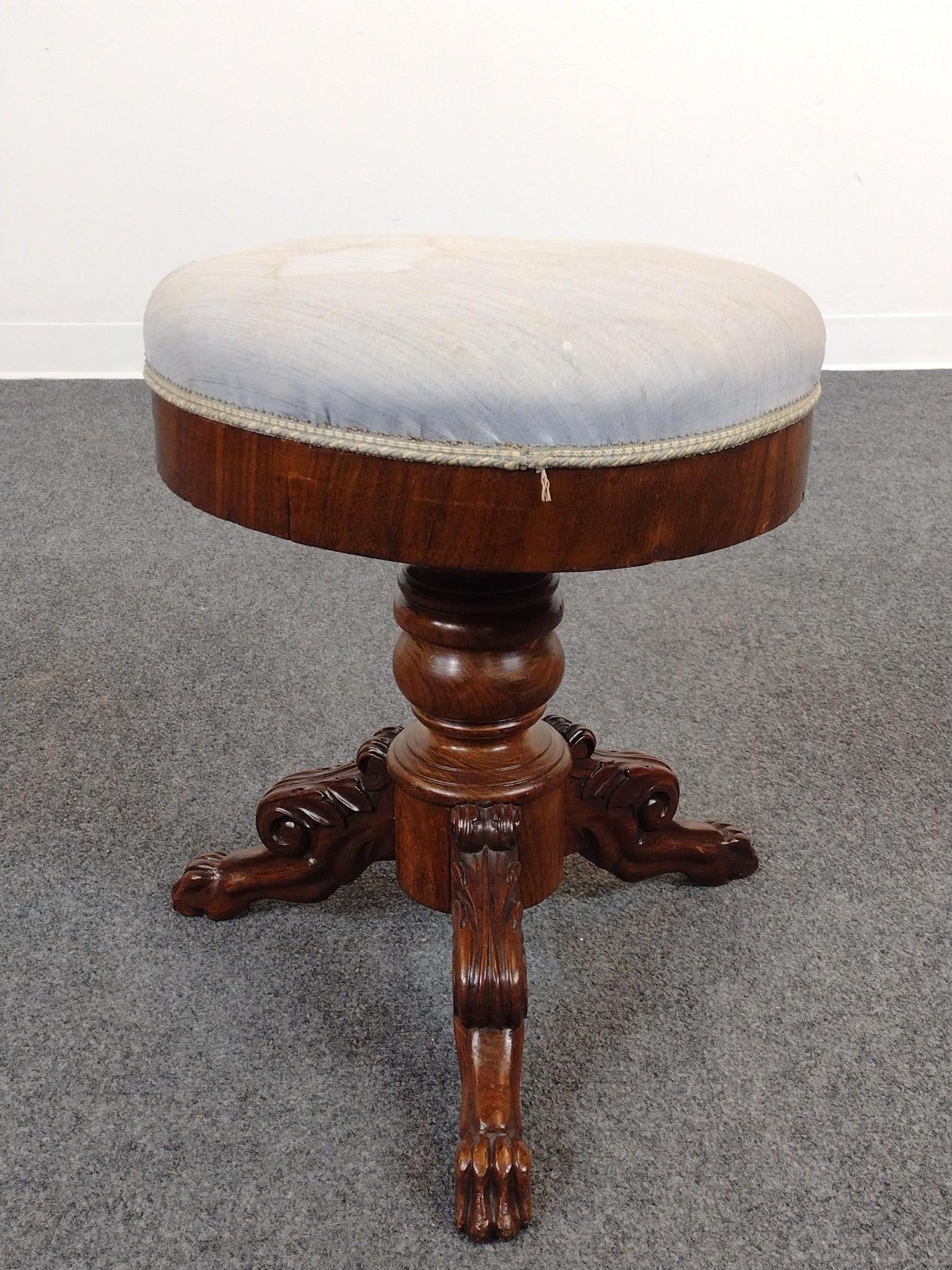 Mahogany Swivel Piano Stool: 15" diameter X 19" high. Upholstery has some stains.