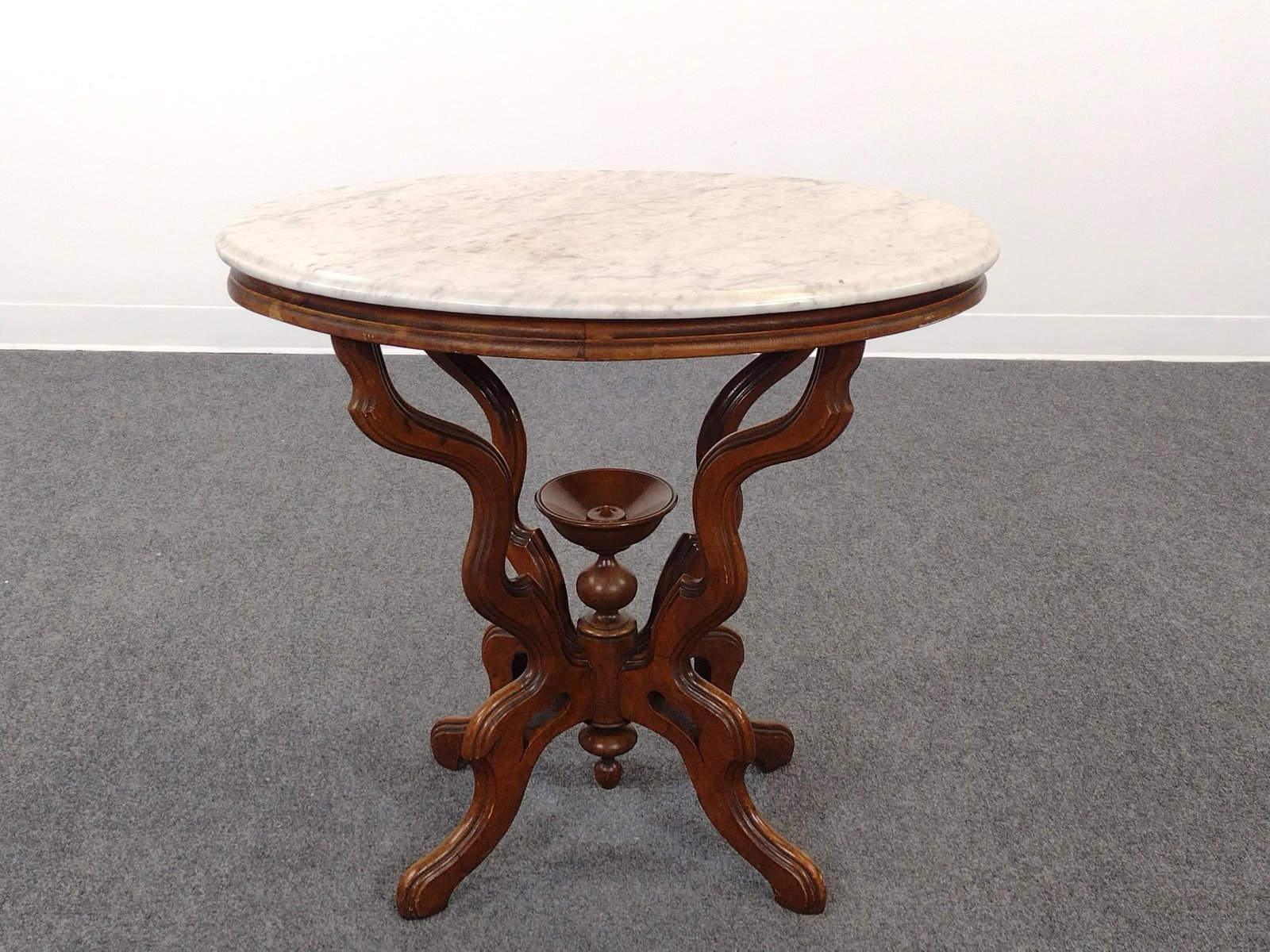 Victorian Marble Top Occasional Table: 30" wide X 20-1/2" deep X 28-1/2" high. Wood base as a few scratches. Marble top has some areas of discoloring.