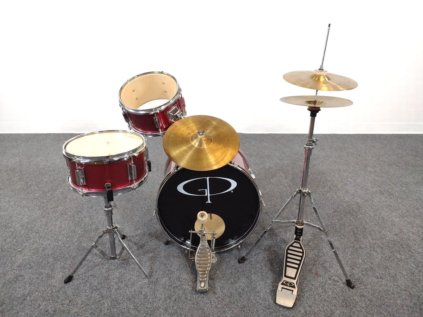 GP Childs Drum Set: Setup 43" wide X 26" deep X 36" high. Has some signs of wear.