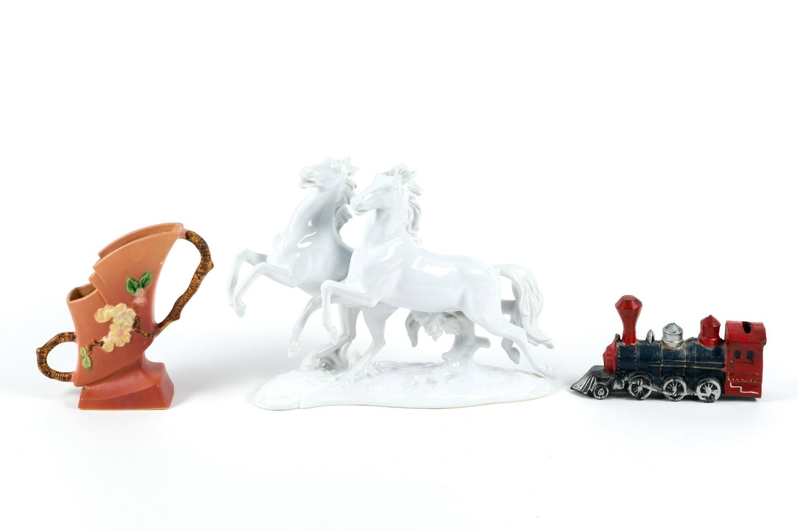 Roseville Vase, Bank and Horse Figure: Includes cast iron train piggy bank and Keramons porcelain horse figurine. From 4-1/2" to 10 1/2" tall, and 7-1/2" to 14" wide.