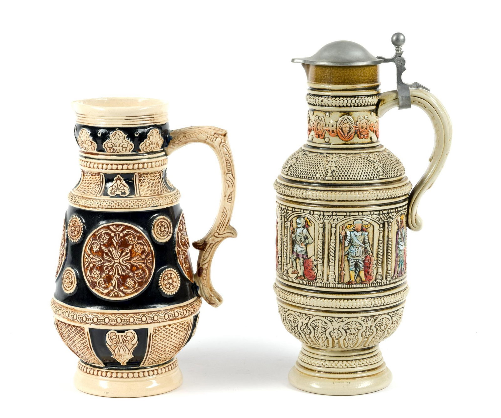 Two Large West German Beer Steins: Both say "Made in West Germany." One missing lid. 7" wide, 11-1/2" to 14" tall.