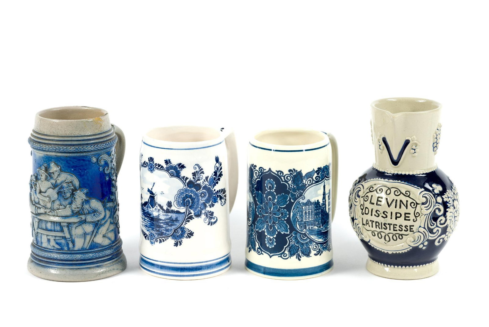 Four Blue and White Beer Mugs incl. Delft: Others marked "Made in Germany" and "Made in Holland." One missing lid. 5" wide to 5 1/4" to 6-5/8" tall.