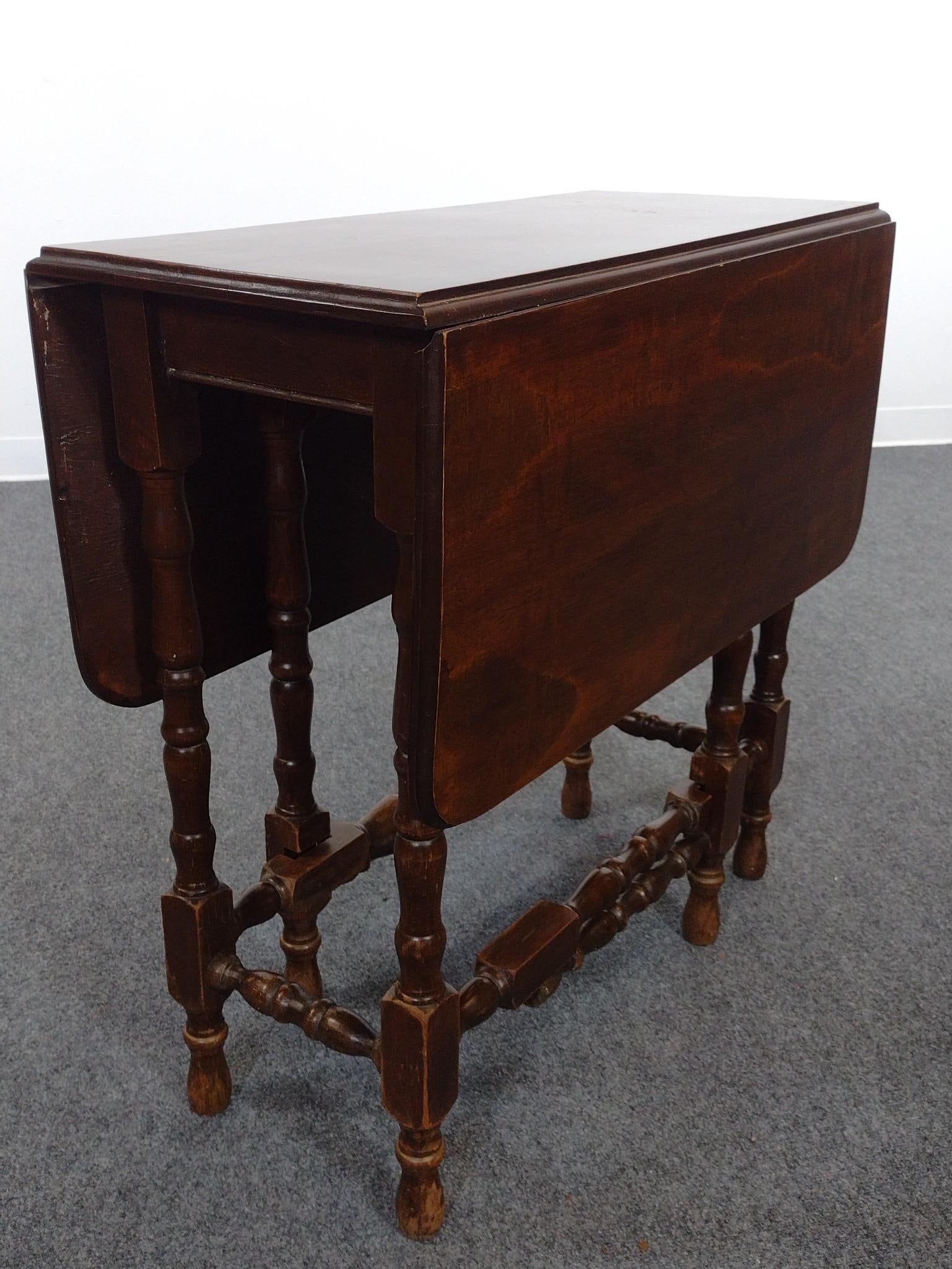 Gate Leg Table: Open 40-1/2", closed 14" wide X 30" high. Has some light scratches. Legs have some finish loss around base.