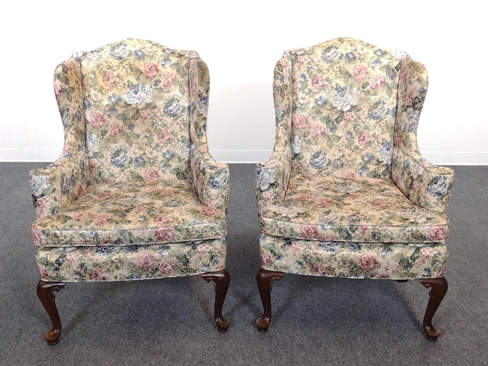 Pair Of Floral Print Wingback Chairs: Each 28-1/2" wide X 28" deep X 41" high. Both have some scratches to legs. No manufactures name found.