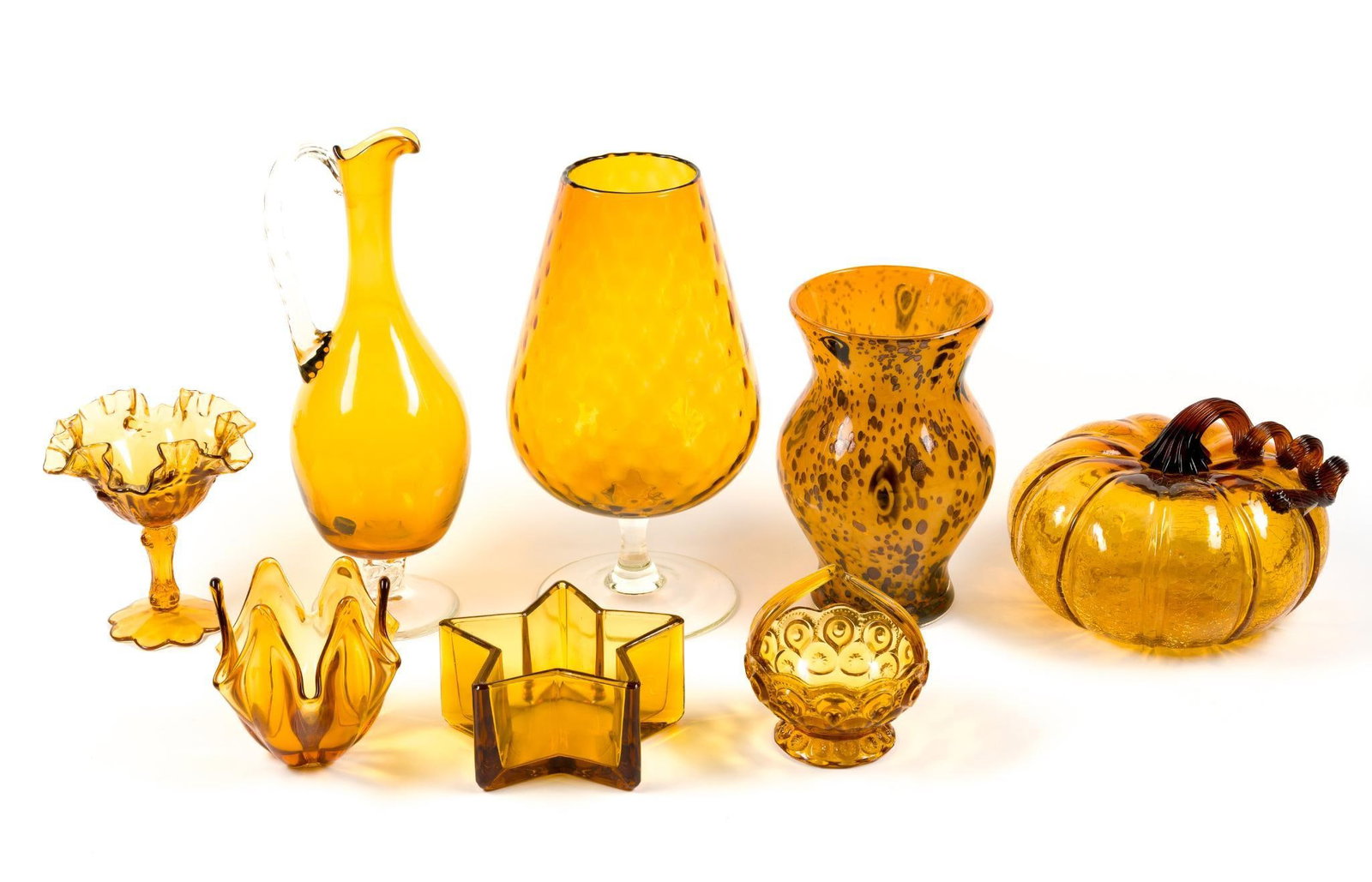 Assorted Amber Glass: Sizes range from 3" to 13" in height by 4" to 8" in width.
