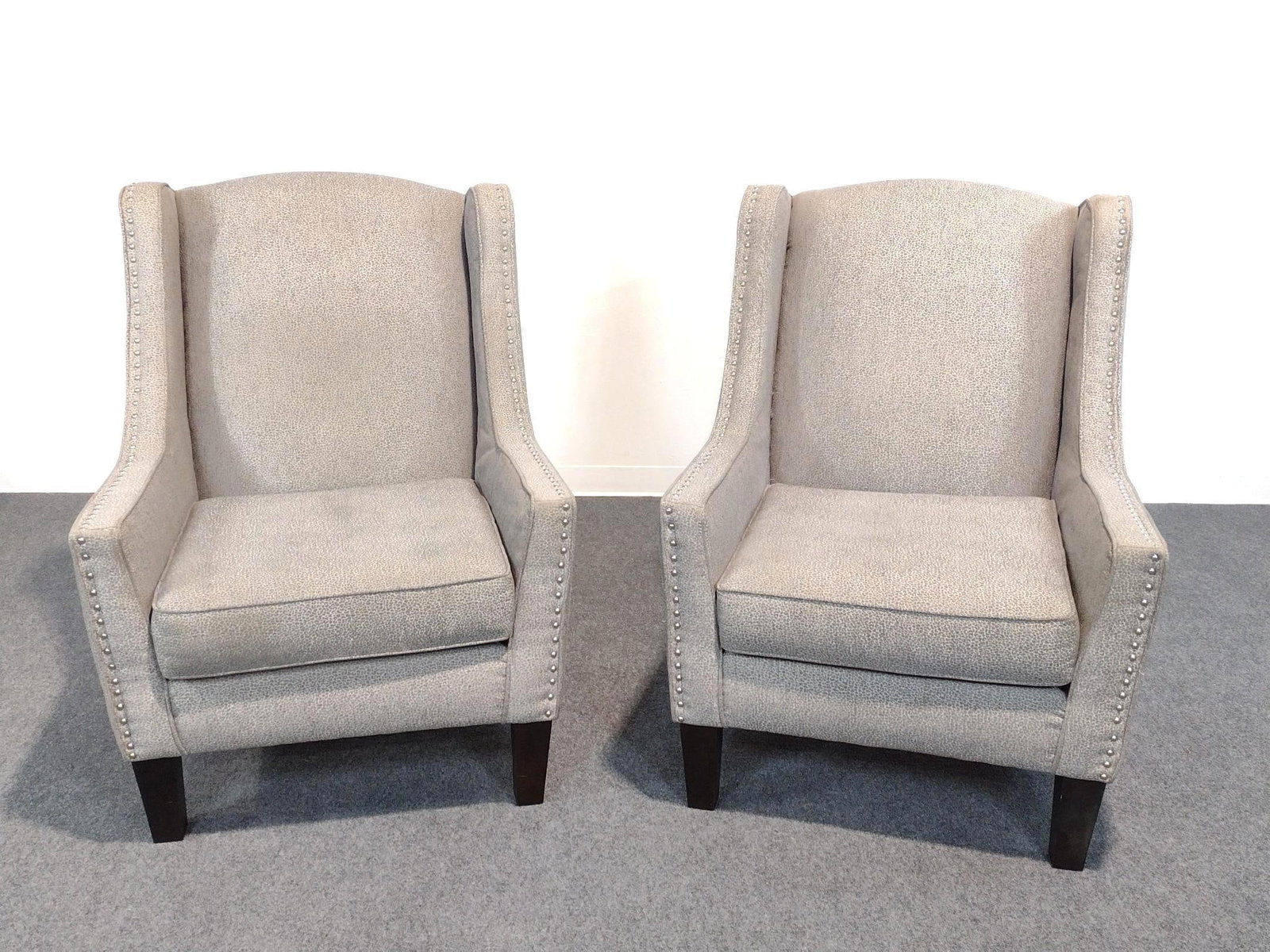 Pair Of American Signature Wing Back Chairs: Each 32" wide X 33" deep X 42-1/2" high. Both have some areas of discoloring.
