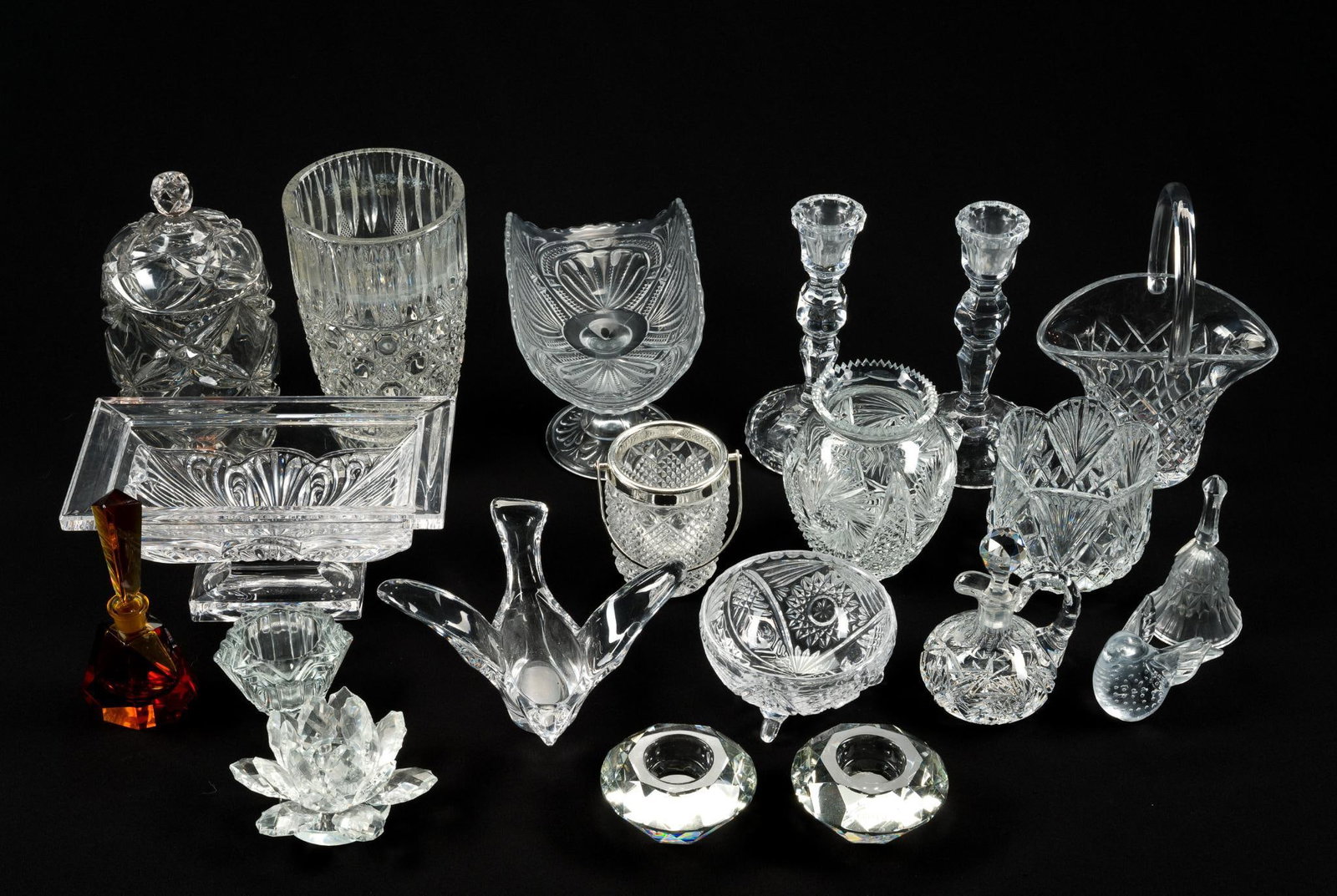 21 Pieces of Cut Glass Incl. Made in Germany: Largest vase is 5 - 1/4" by 9 - 1/4". Smallest piece is 3 - 3/4" by 2 - 1/4".