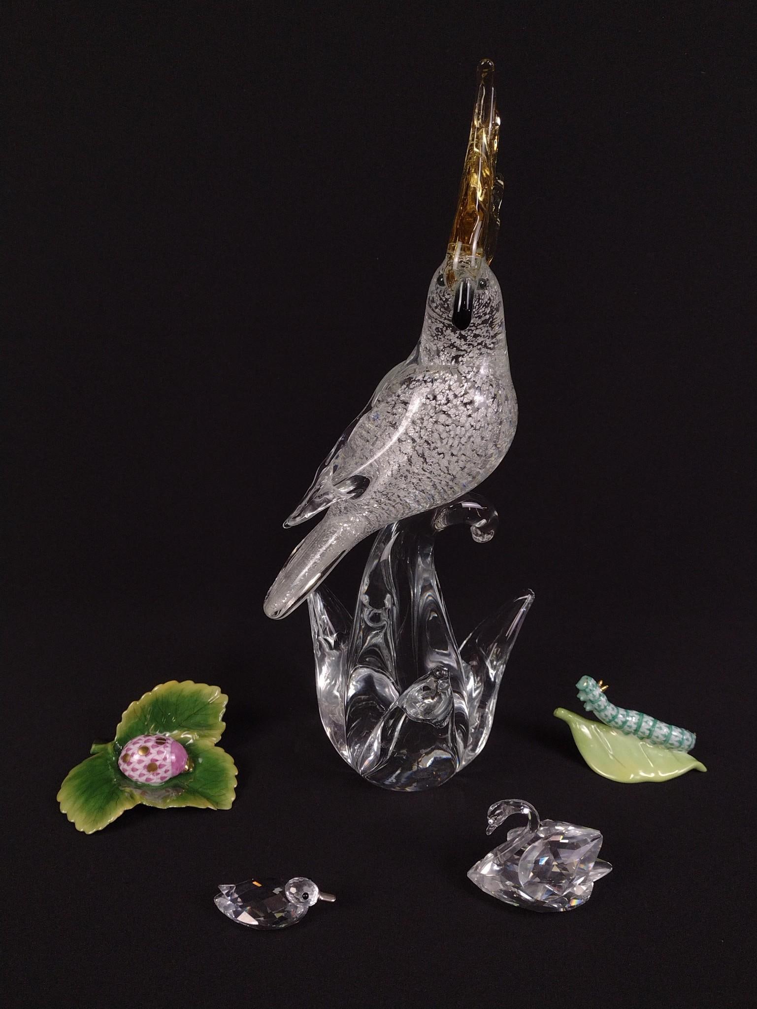 5 Decorative Glass and Porcelain Pieces Incl. Murano: Includes Murano cockatoo statue, two Harend porcelain bugs on leaves and two Swarovski crystal birds. Cockatoo measures 5" in width and 12 - 1/4" in height, and the smallest Swakorski measures 2" by