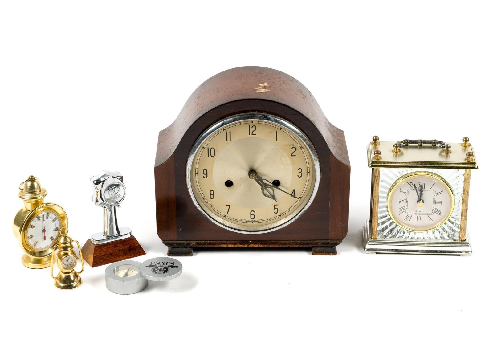 Six Desk Clocks: Largest clock measures 8 - 1/4" tall by 4 - 1/8" deep by 9 - 1/4" wide, smallest clock is 3" tall and 1 - 1/2" wide.