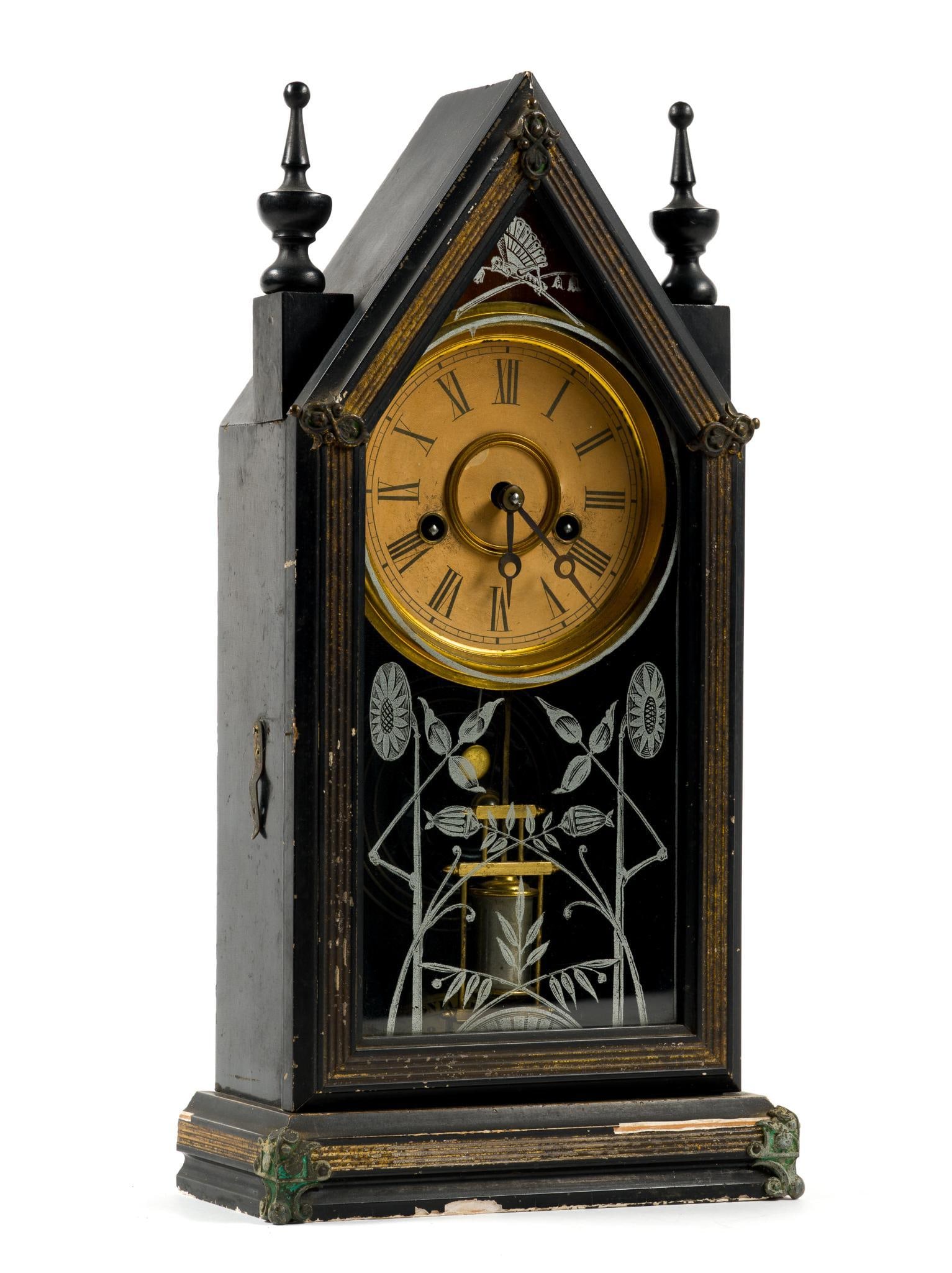 Ansonia Gothic Clock: Mantle clock measures 16" in height by 8 - 1/4" in width. Wear as expected with age and top hinge of door needs repaired.