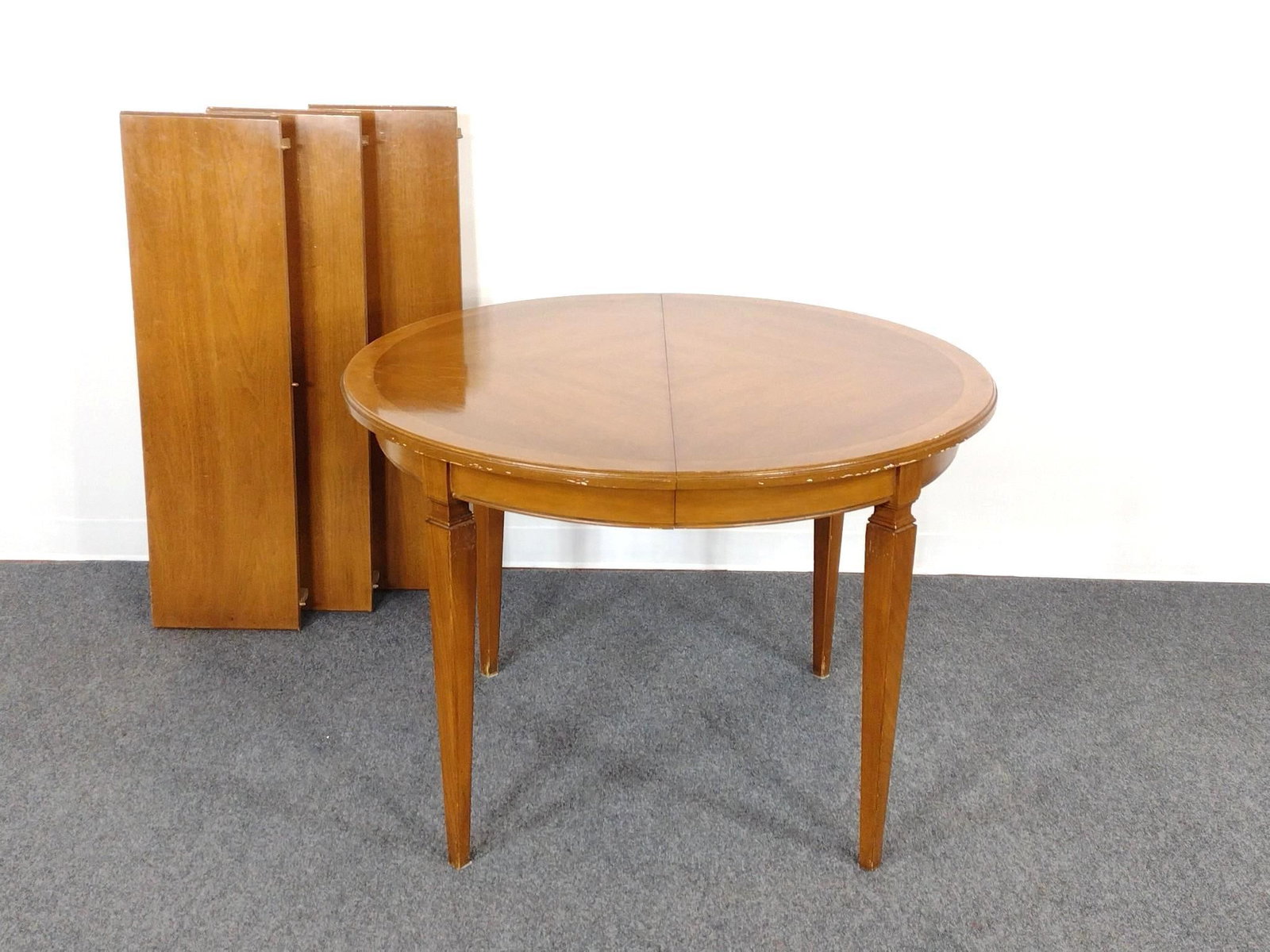 Round Dining Table w/ Leaves: Table 42" diameter X 29-1/2" high. Leaves 12" wide each. No manufactures name found. Has some light scratches.