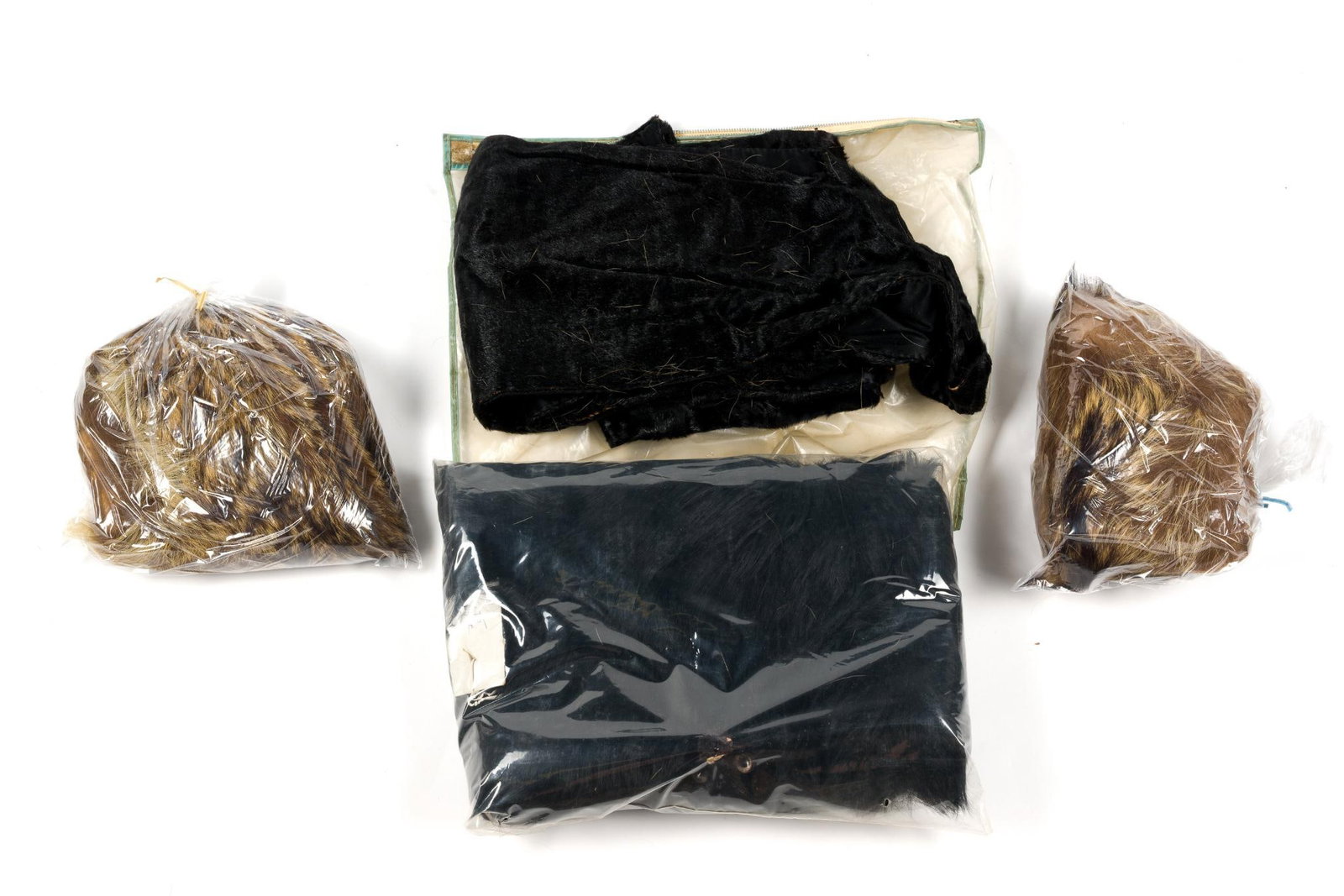 Lot of Four Fur Fashion Items: Strong odor of cigarettes. Box measures 14 - 1/2" in height by 11 - 1/2" in depth by 6 - 1/2" in width.