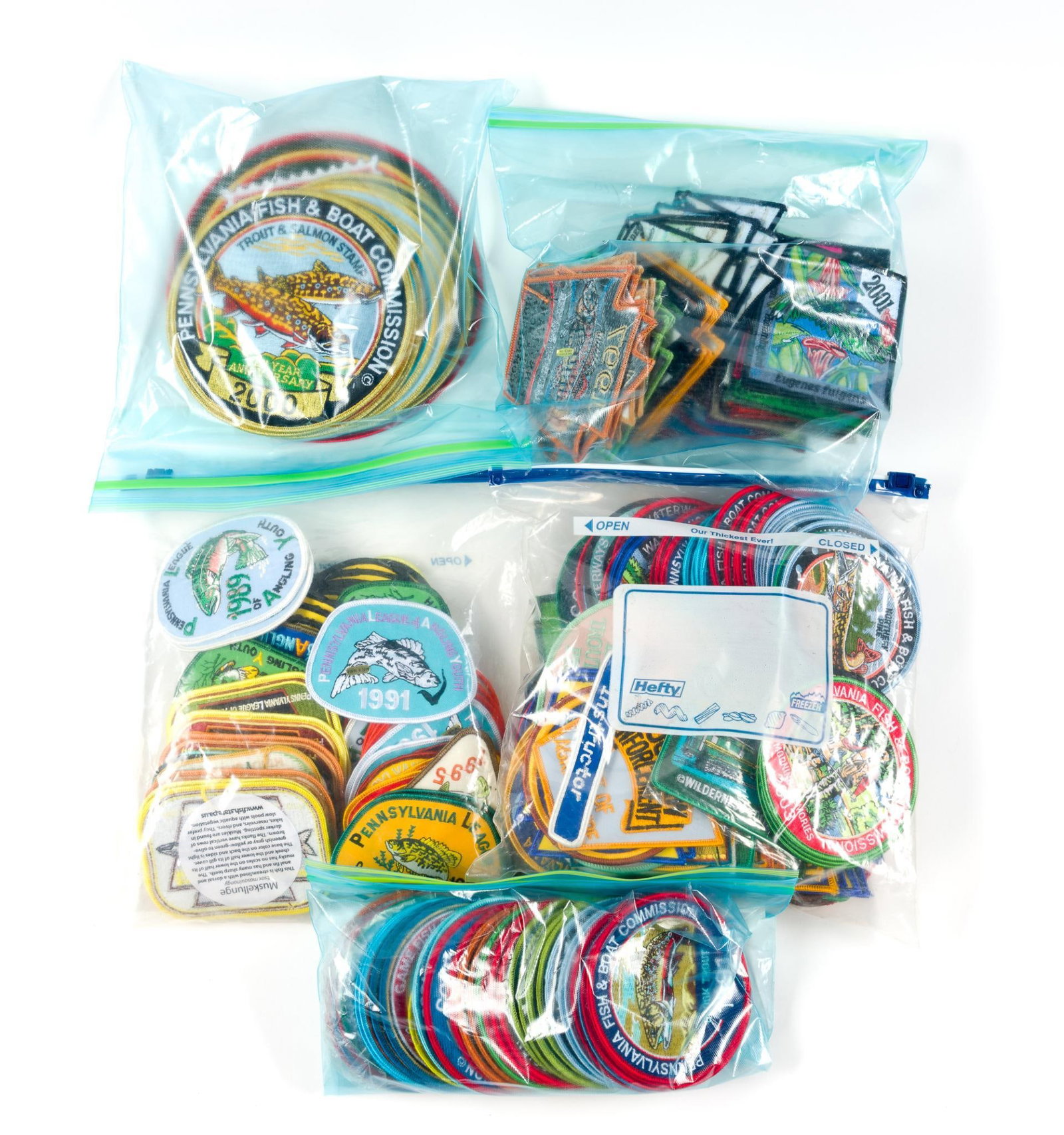 Assorted Patches: Mostly Pennsylvania Fish & Boat Commission patches. Largest patches measure 8" across, the smallest is 3" across. Also includes a 2000 PA Fish & Boat 1" commemorative pin.