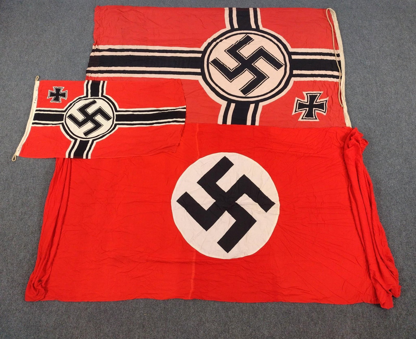 3 German WWII Banners and Flags: Large 12'9" wide X 4'6" high. Medium 7'6" wide X 4'8" high. Small 4'3" wide X 2'6" wide.