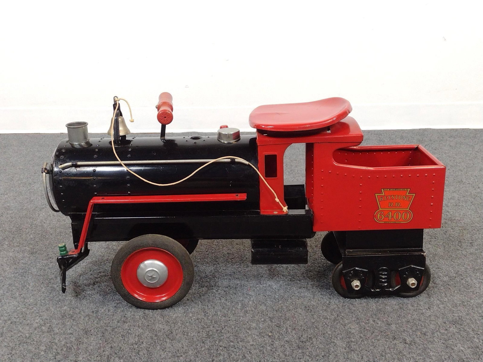 Pressed Steel Keystone R.R. 6400 Train Riding Toy: 7-1/2" wide X 26" long X 13" high. Has some scratches and discoloring.