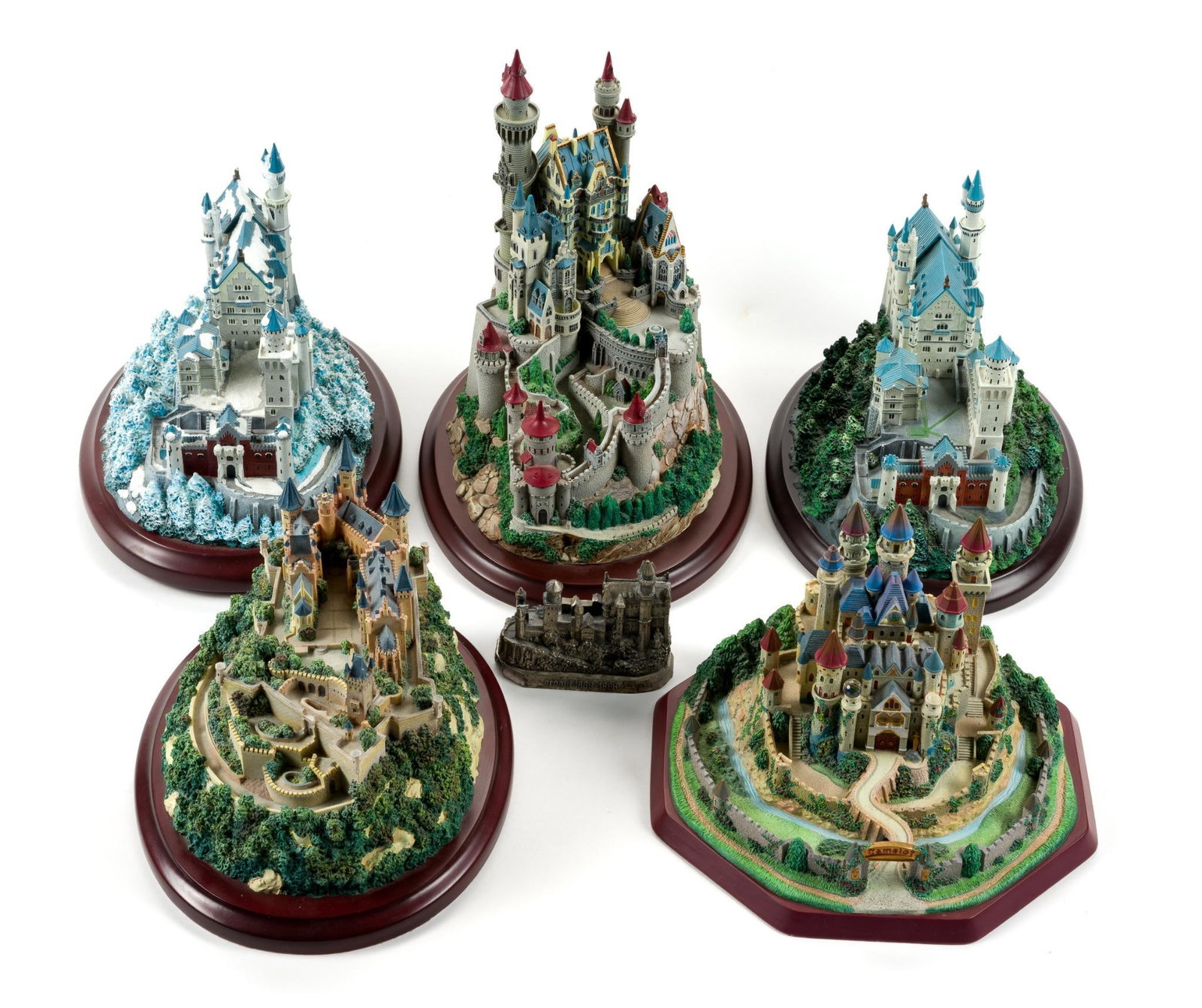 5 Lenox Castle Statues: Includes German castles Falkenstein, Hohenzollern, Neuschwanstein, and Winter at Neuschwanstein. Also includes Camelot and miniature pewter Neuschwanstein Castle. Largest measures 10 - 1/4" by 8 - 1/4