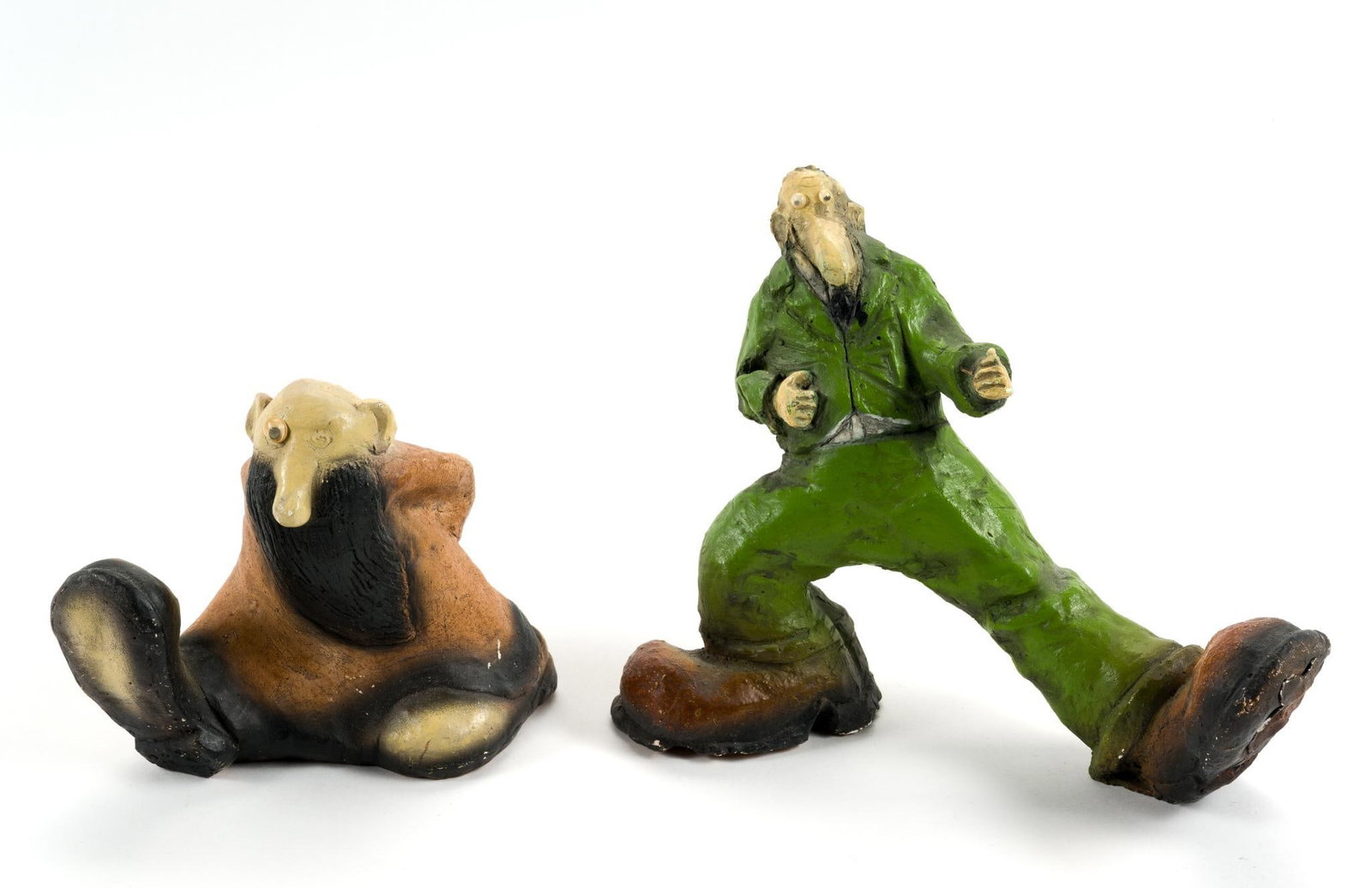 2 Vintage R. Crumb Ceramic Statues: Larger figure measures 9" by 7" in height. Smaller measures 6" by 4 - 1/2" in height. Smaller one is missing an eye and has a chip out of the base of the statue.