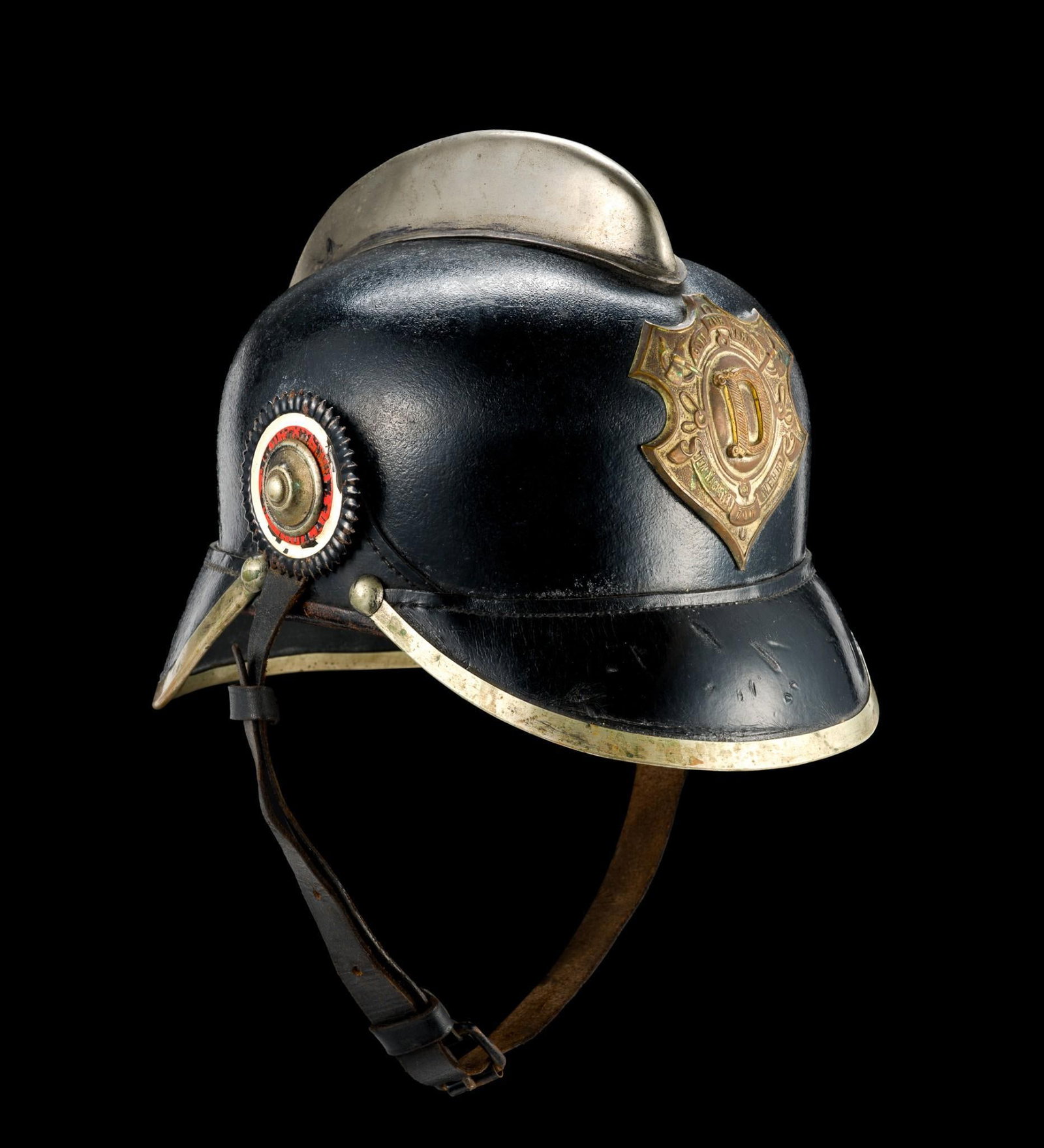 Antique German Fireman's Helmet: 9" length, 7 - 1/4" depth and 8" in height. Signs of age on helmet.
